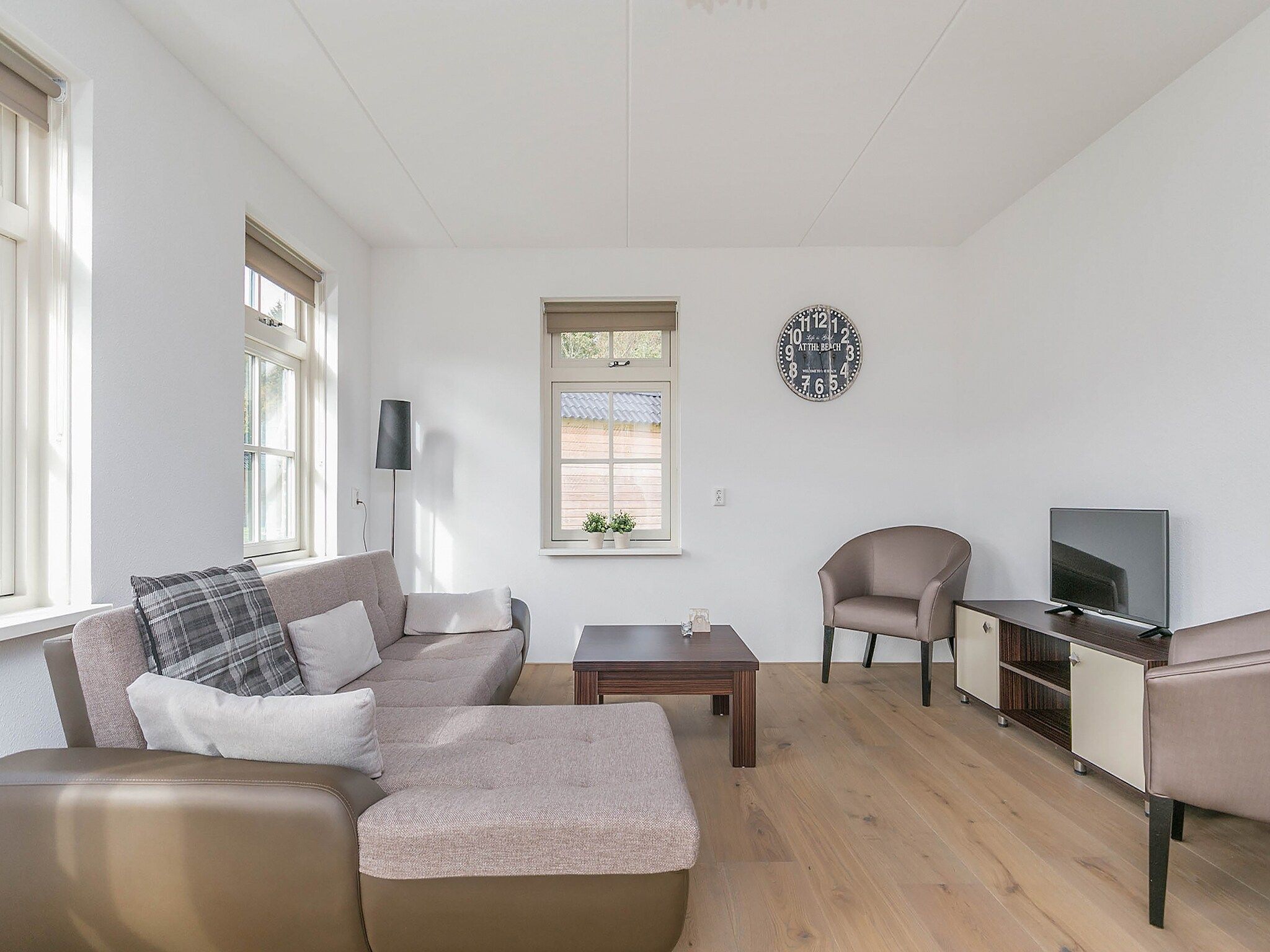 De woonkamer van Villaparc Schoonhovenseland in Hollandscheveld