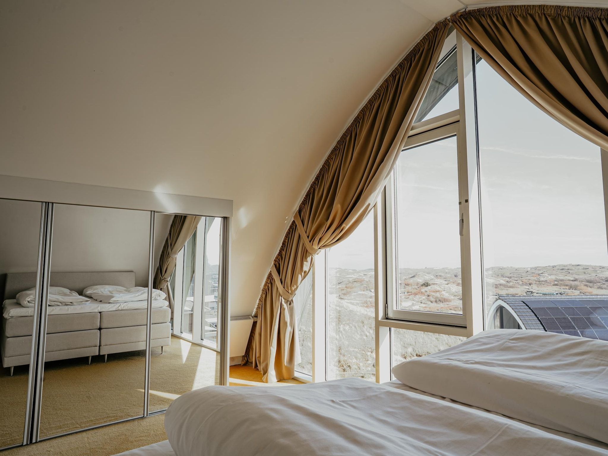 Een slaapkamer van De ZeeParel Pink Shrimp in Egmond aan zee