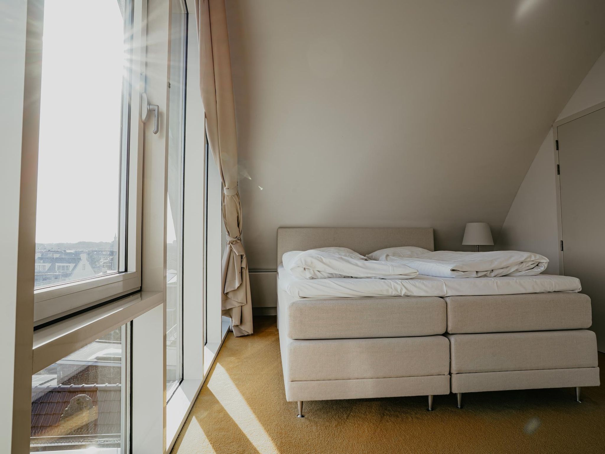 Een slaapkamer van De ZeeParel Pink Shrimp in Egmond aan zee