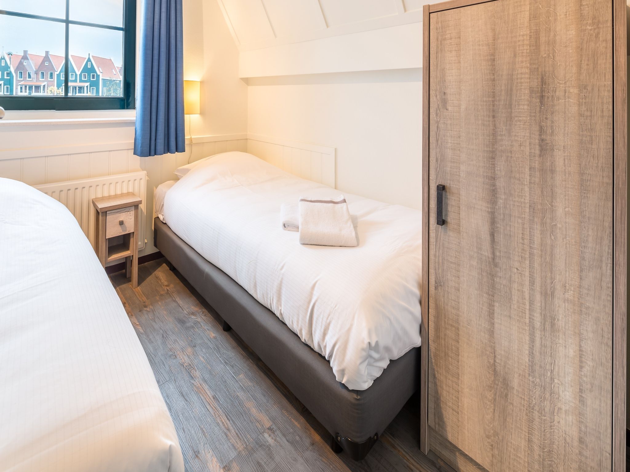 Een slaapkamer van Marinapark Volendam 4 in Volendam