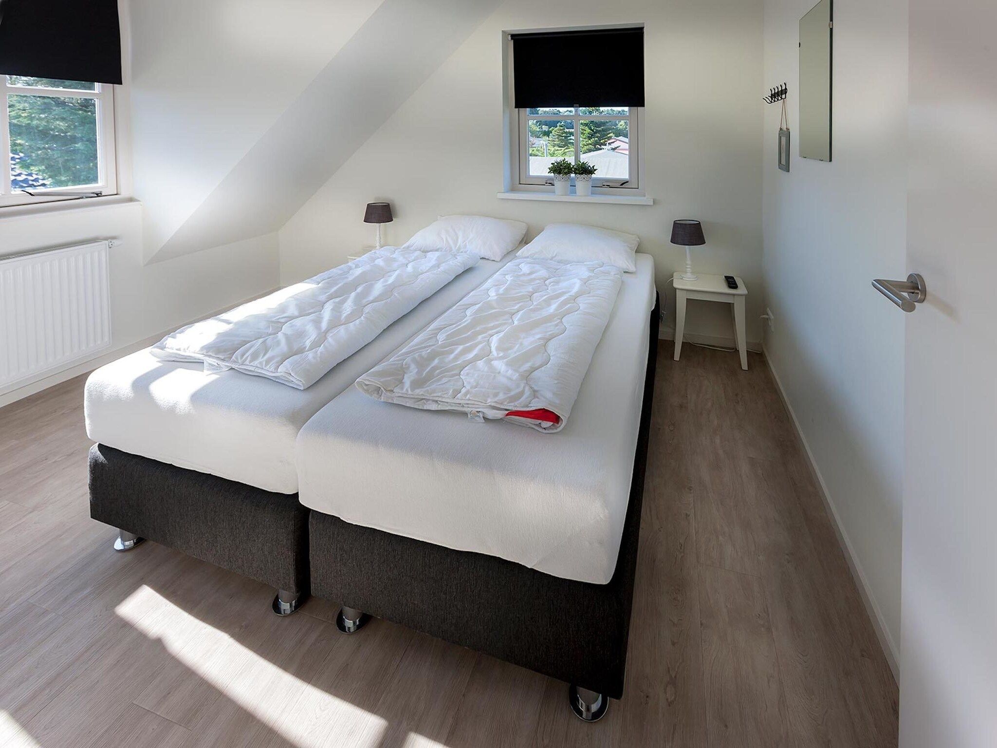 Een slaapkamer van Bungalowpark de Gouden Spar 5 in Noordwijk