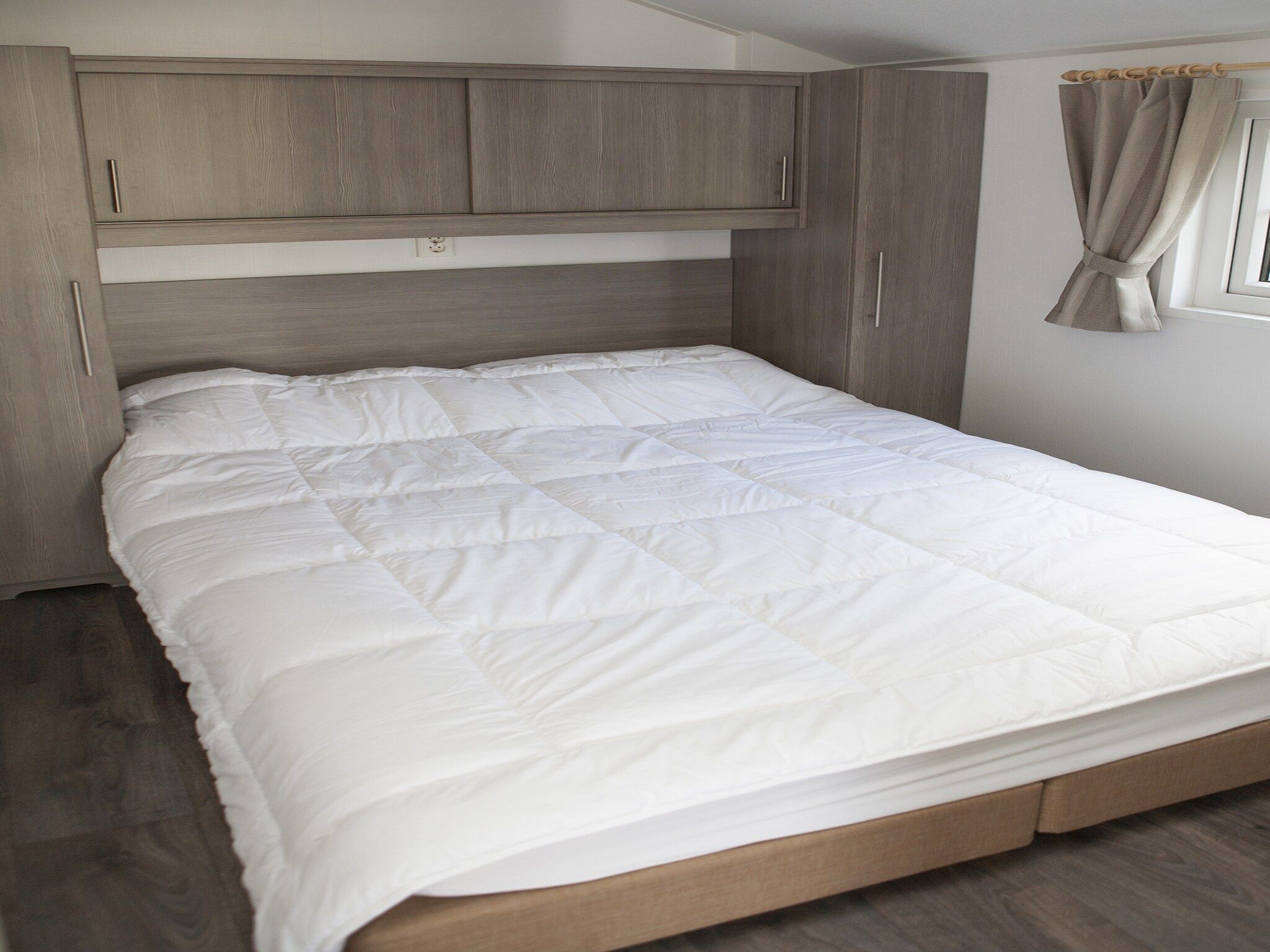 Een slaapkamer van Recreatiepark de Boshoek 9 in Voorthuizen