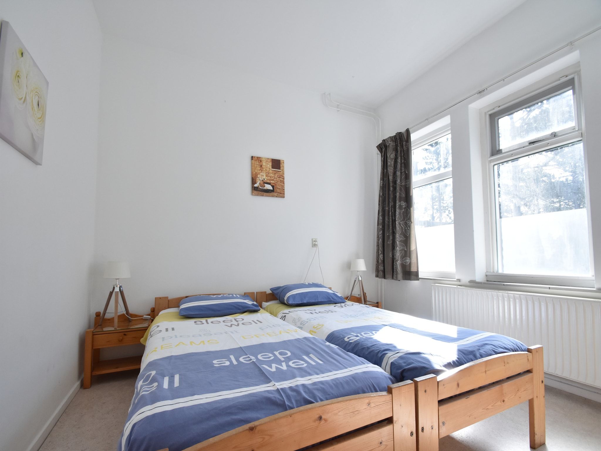 Een slaapkamer van Huize Glory Turkoois in Bergen aan Zee