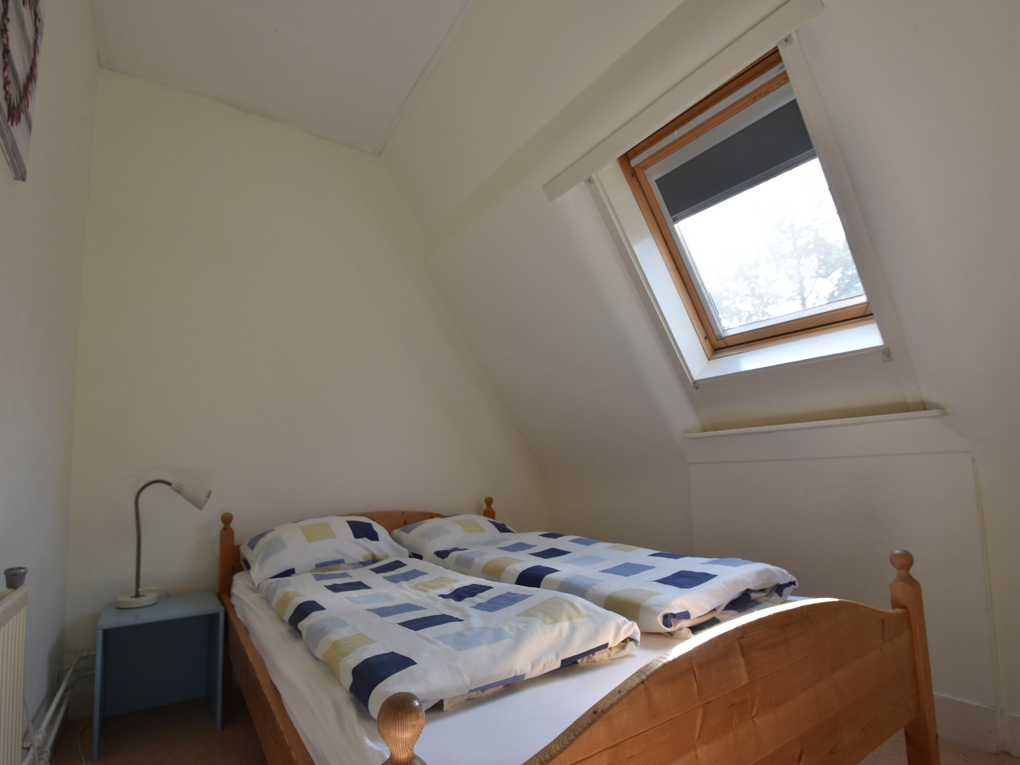 Een slaapkamer van Huize Glory Turkoois in Bergen aan Zee