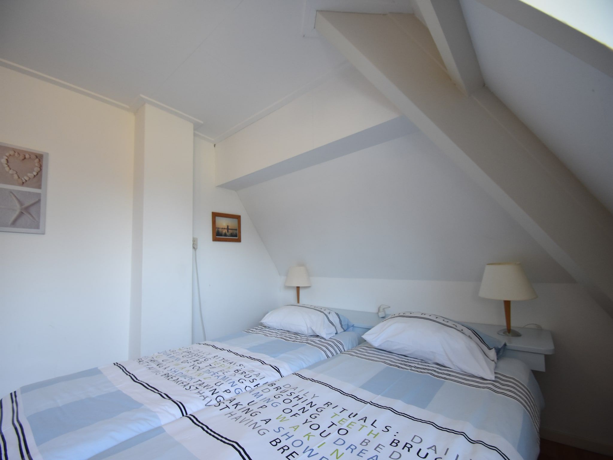 Een slaapkamer van Huize Glory Turkoois in Bergen aan Zee