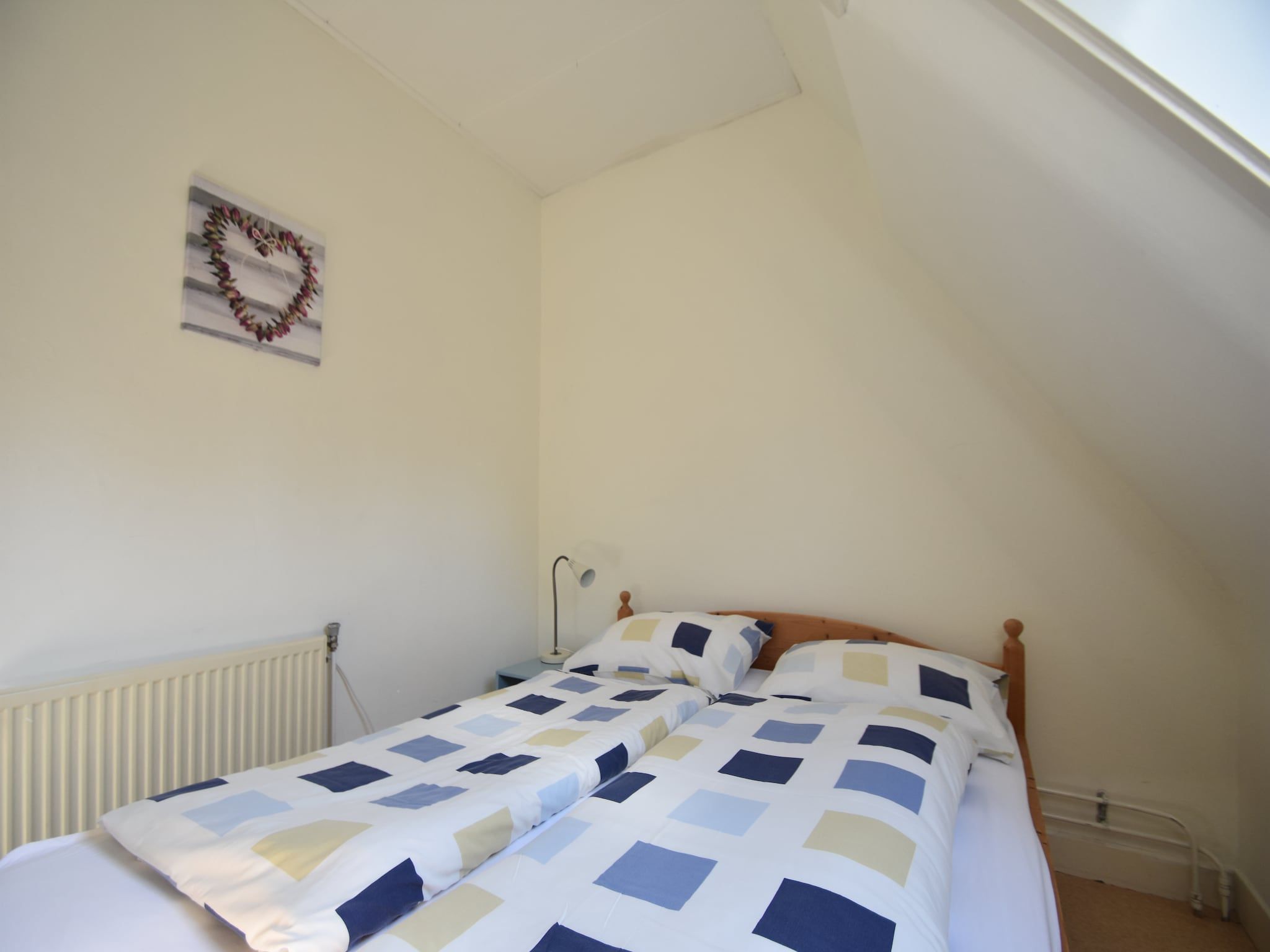 Een slaapkamer van Huize Glory Turkoois in Bergen aan Zee