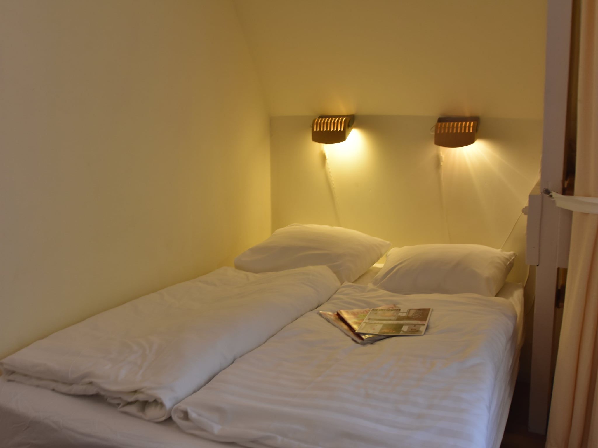 Een slaapkamer van Huize Glory Bergkristal in Bergen aan Zee