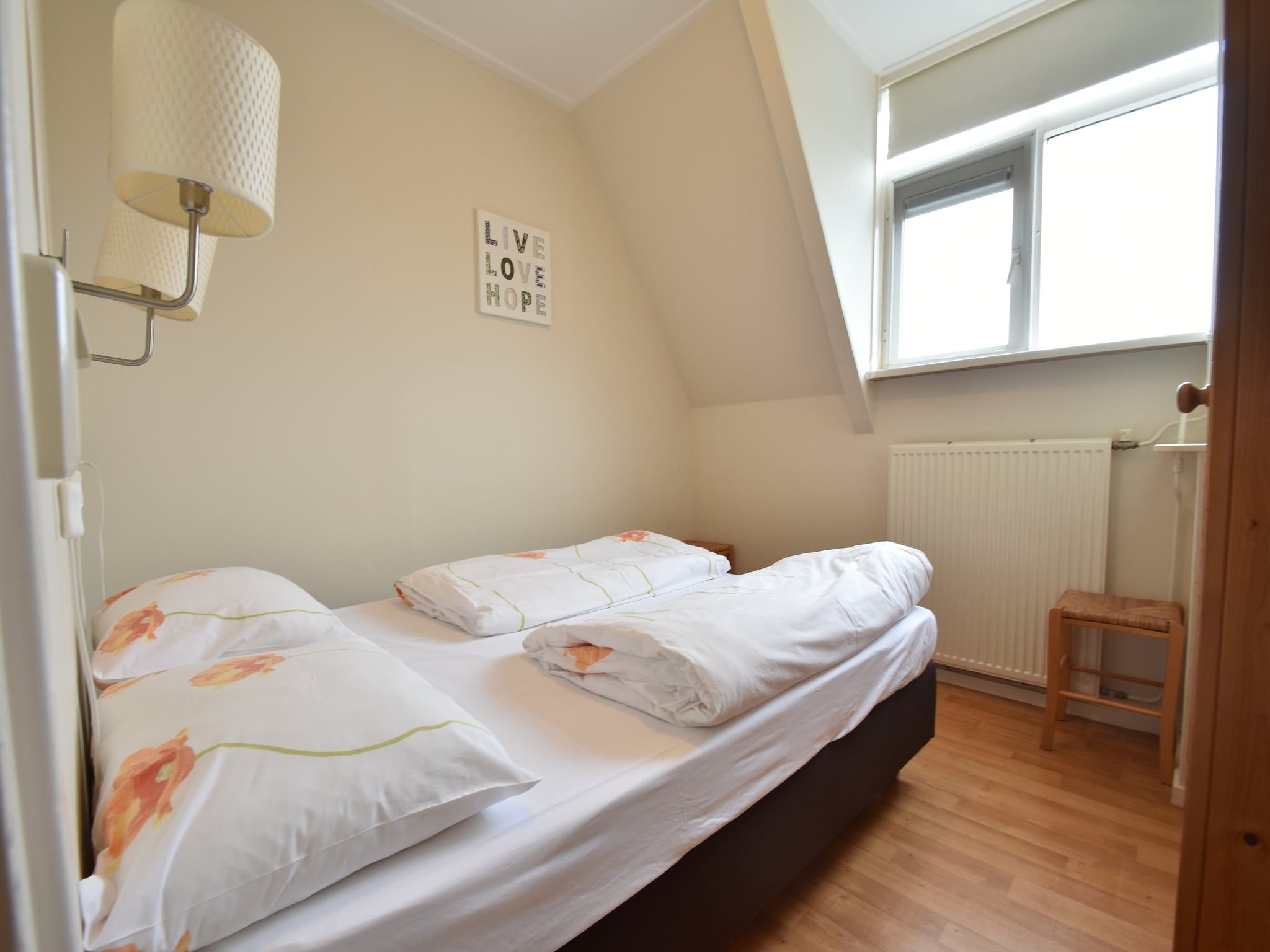 Een slaapkamer van Huize Glory Tijgeroog in Bergen aan Zee