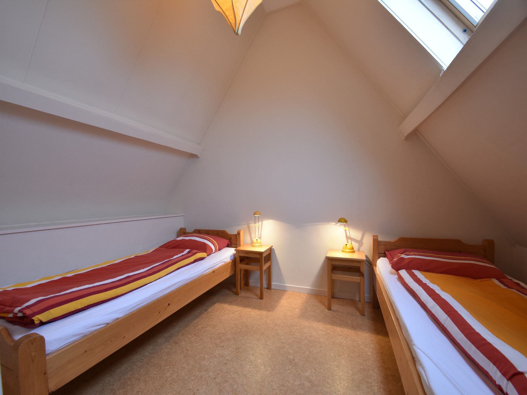 Een slaapkamer van Huize Glory Tijgeroog in Bergen aan Zee