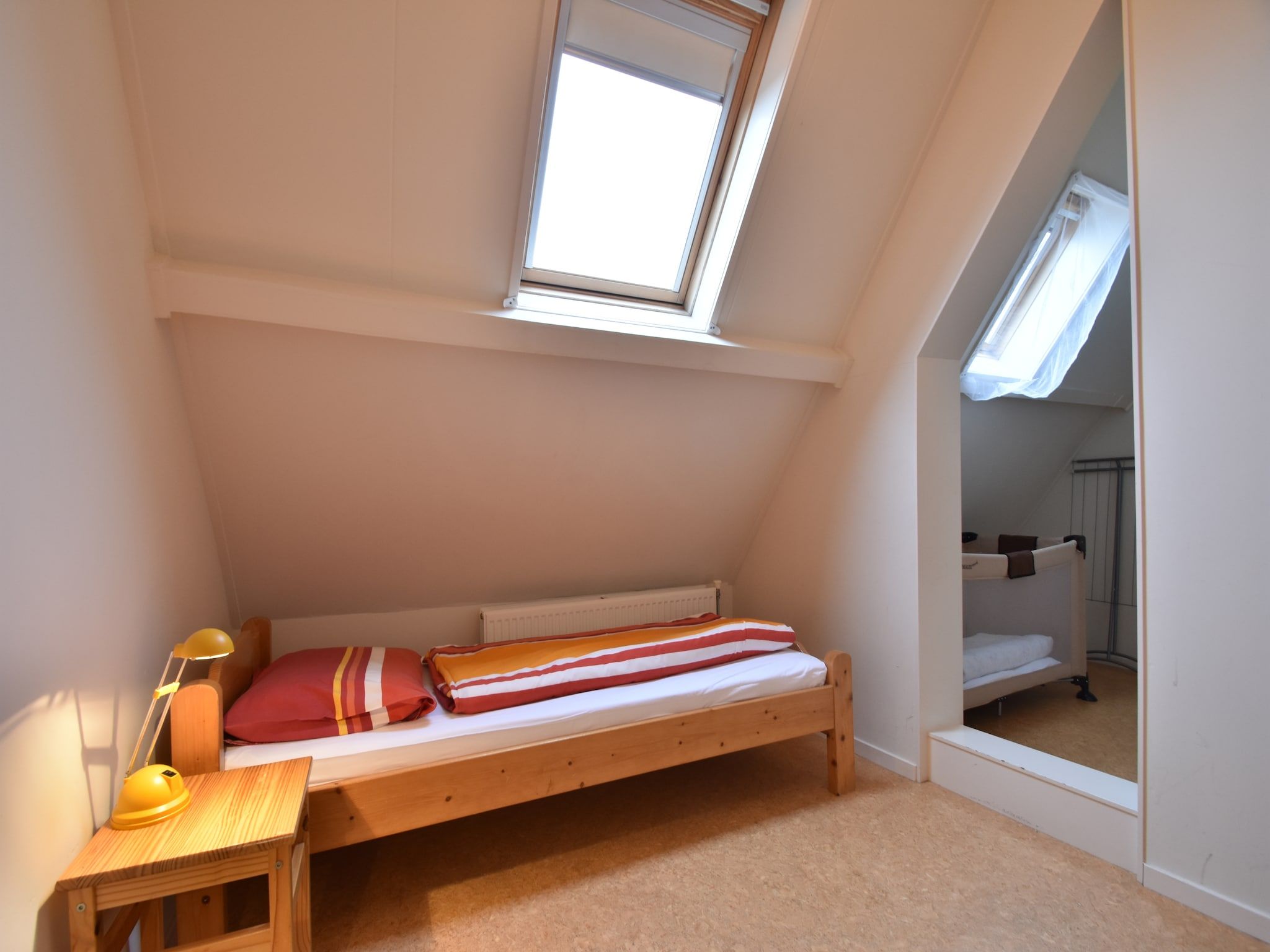 Een slaapkamer van Huize Glory Tijgeroog in Bergen aan Zee