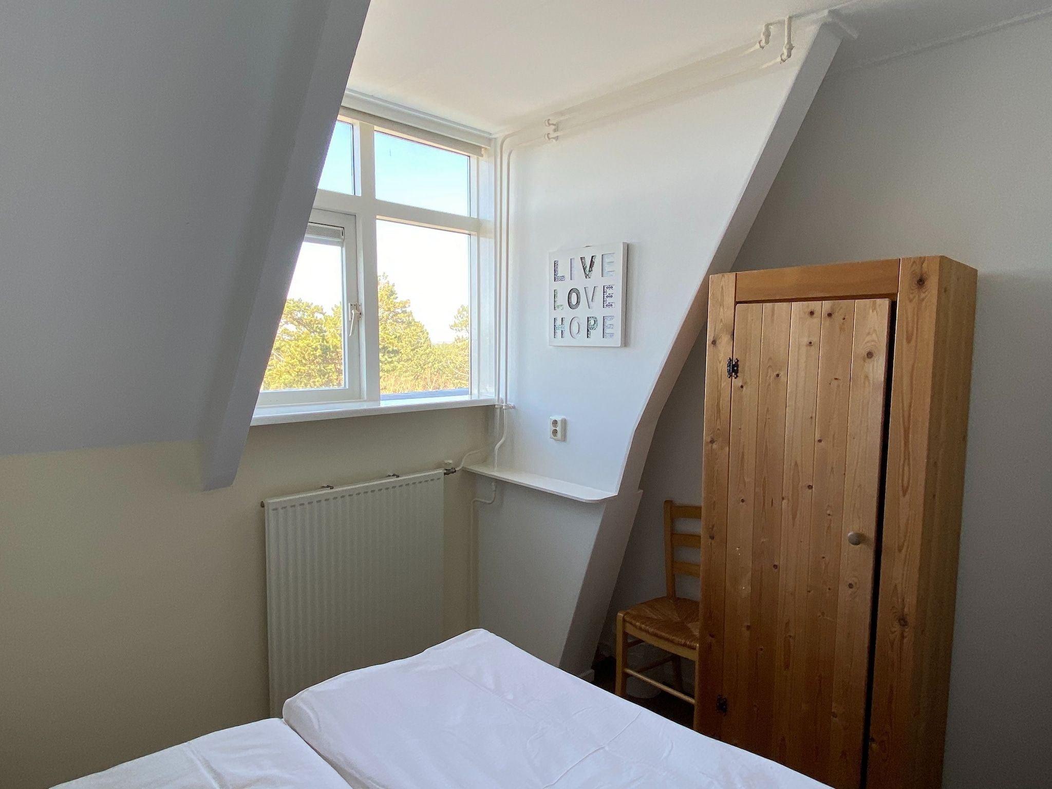 Een slaapkamer van Huize Glory Tijgeroog in Bergen aan Zee
