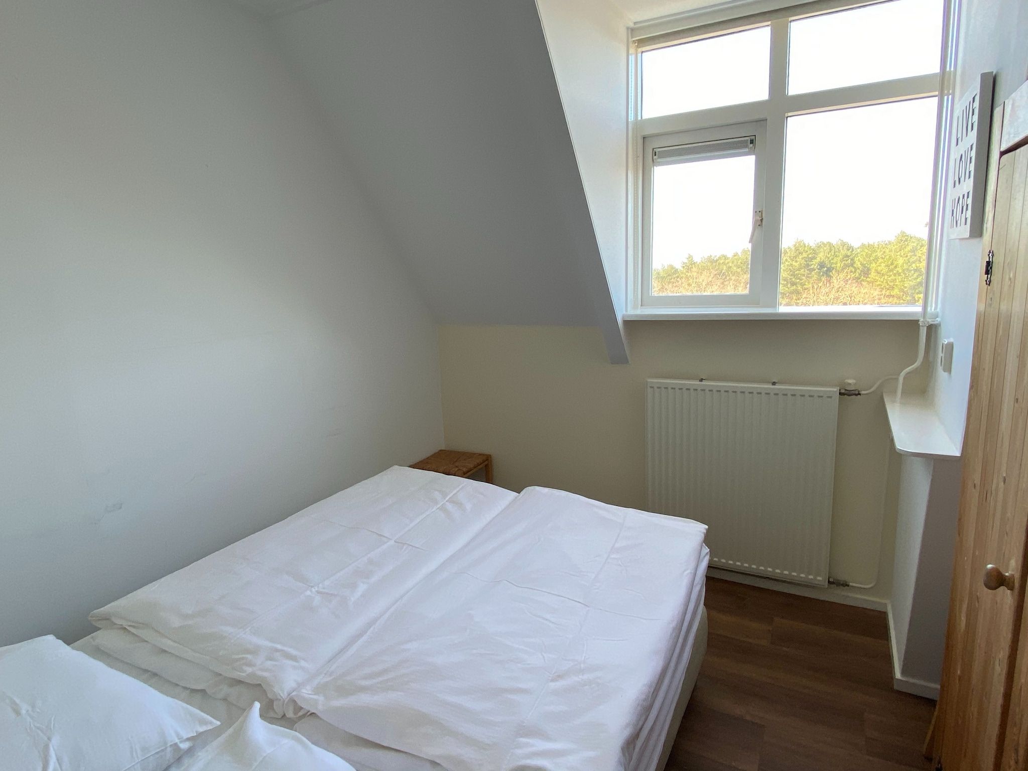 Een slaapkamer van Huize Glory Tijgeroog in Bergen aan Zee