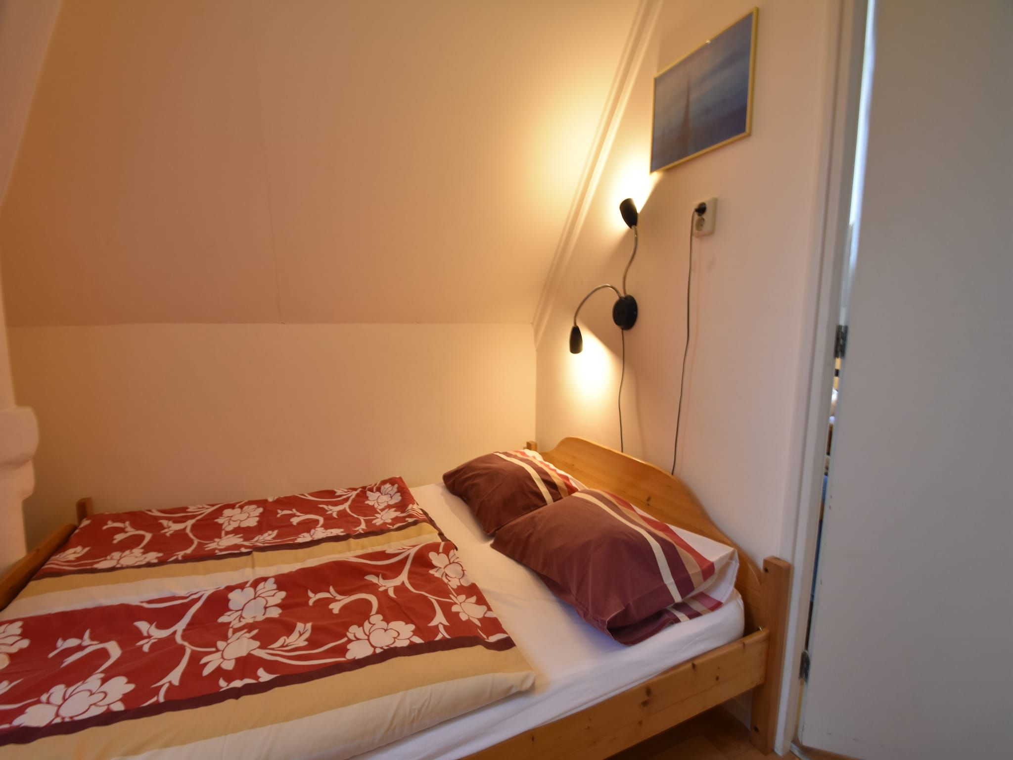 Een slaapkamer van Huize Glory Smaragd in Bergen aan Zee