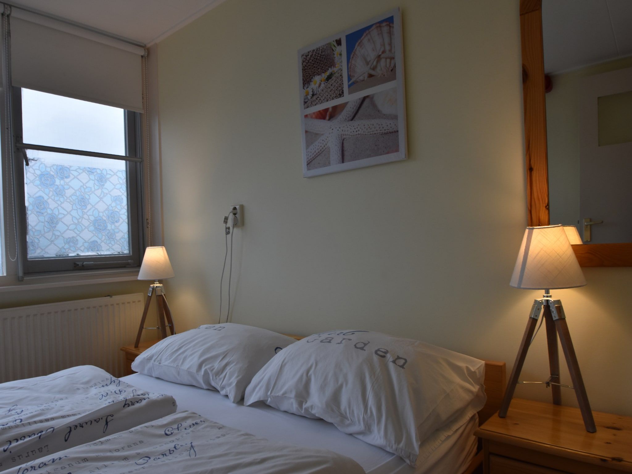 Een slaapkamer van Huize Glory Jade in Bergen aan zee