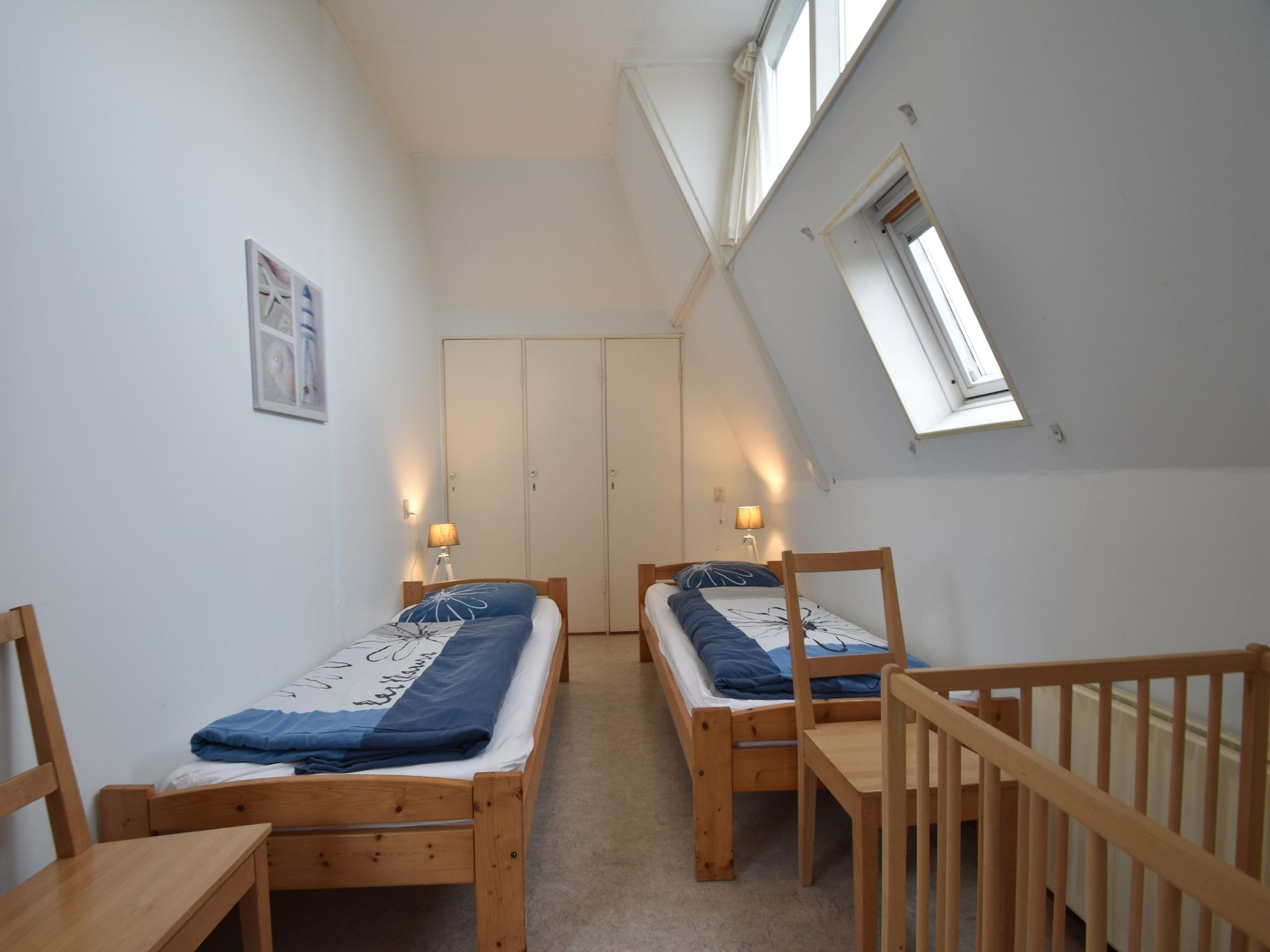 Een slaapkamer van Huize Glory Jade in Bergen aan zee