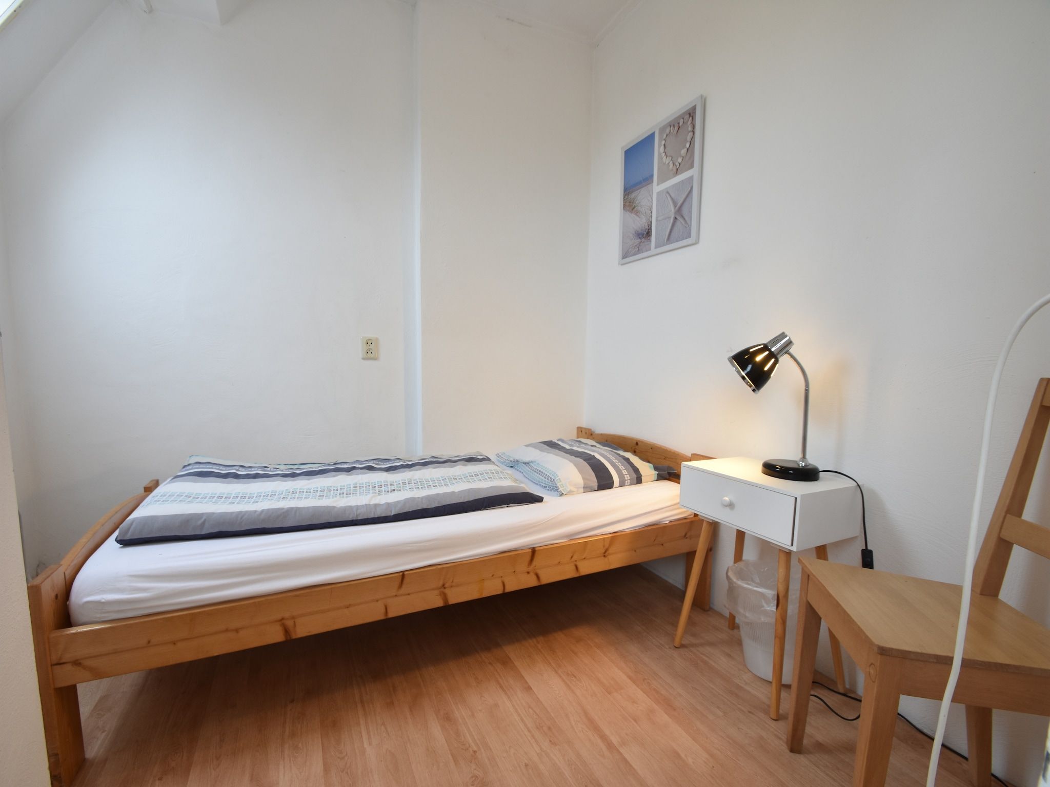 Een slaapkamer van Huize Glory Jade in Bergen aan zee