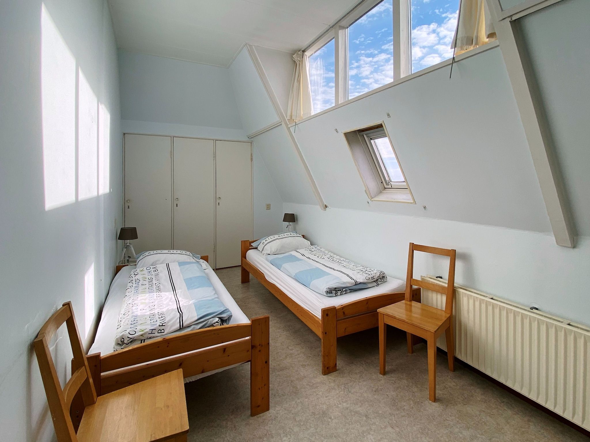 Een slaapkamer van Huize Glory Jade in Bergen aan zee