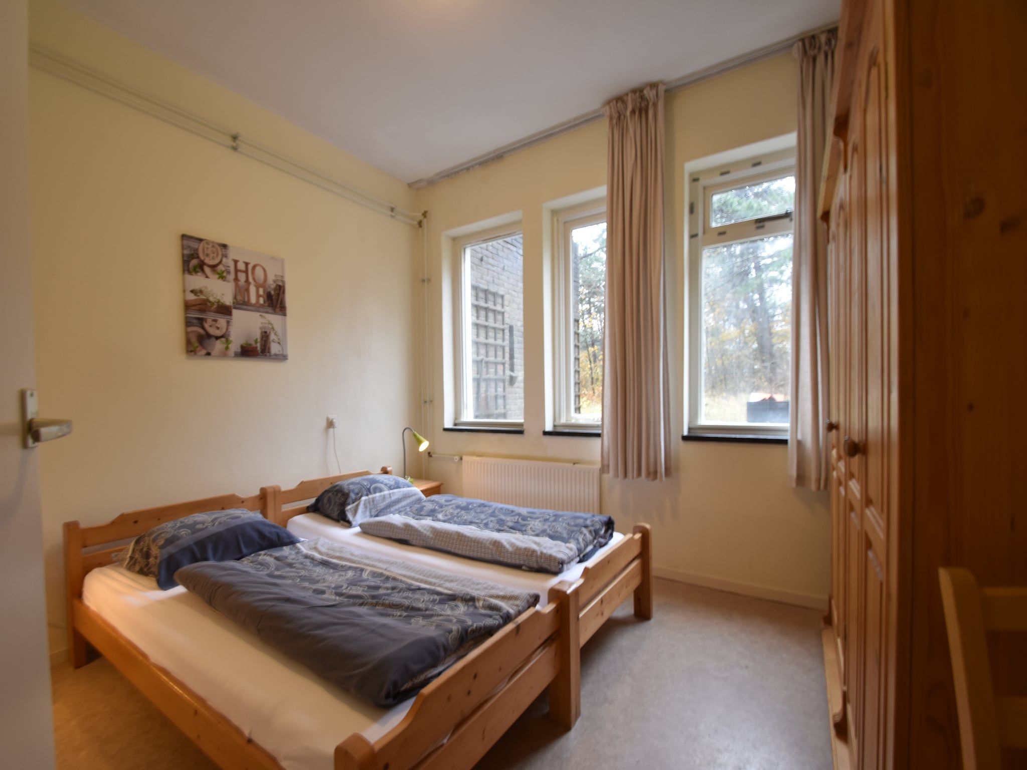 Een slaapkamer van Huize Glory Robijn in Bergen aan zee