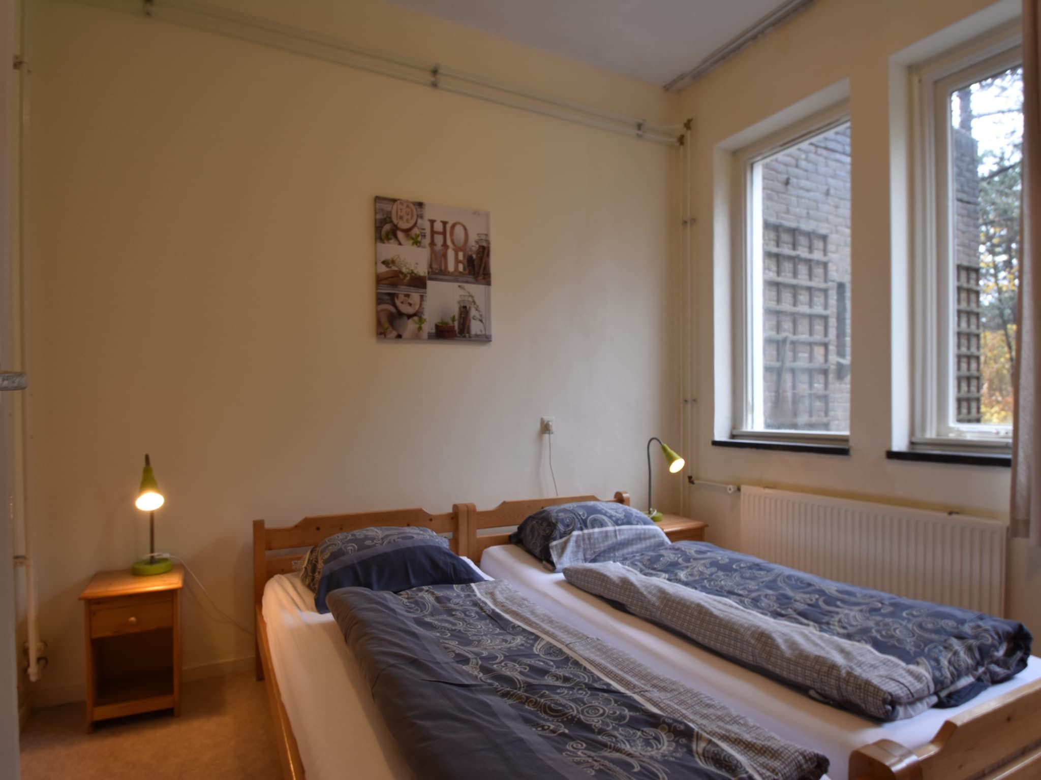 Een slaapkamer van Huize Glory Robijn in Bergen aan zee
