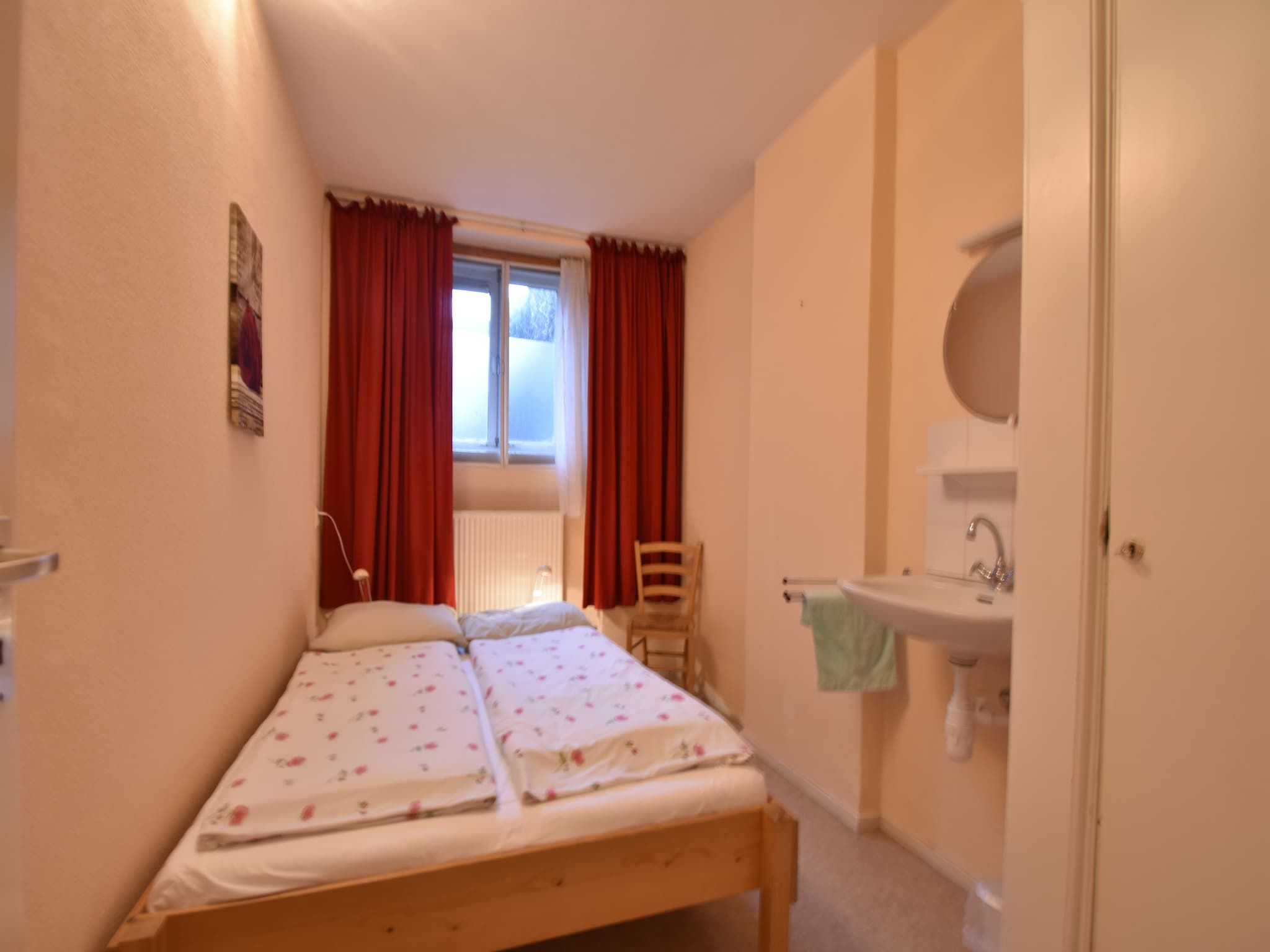 Een slaapkamer van Huize Glory Robijn in Bergen aan zee