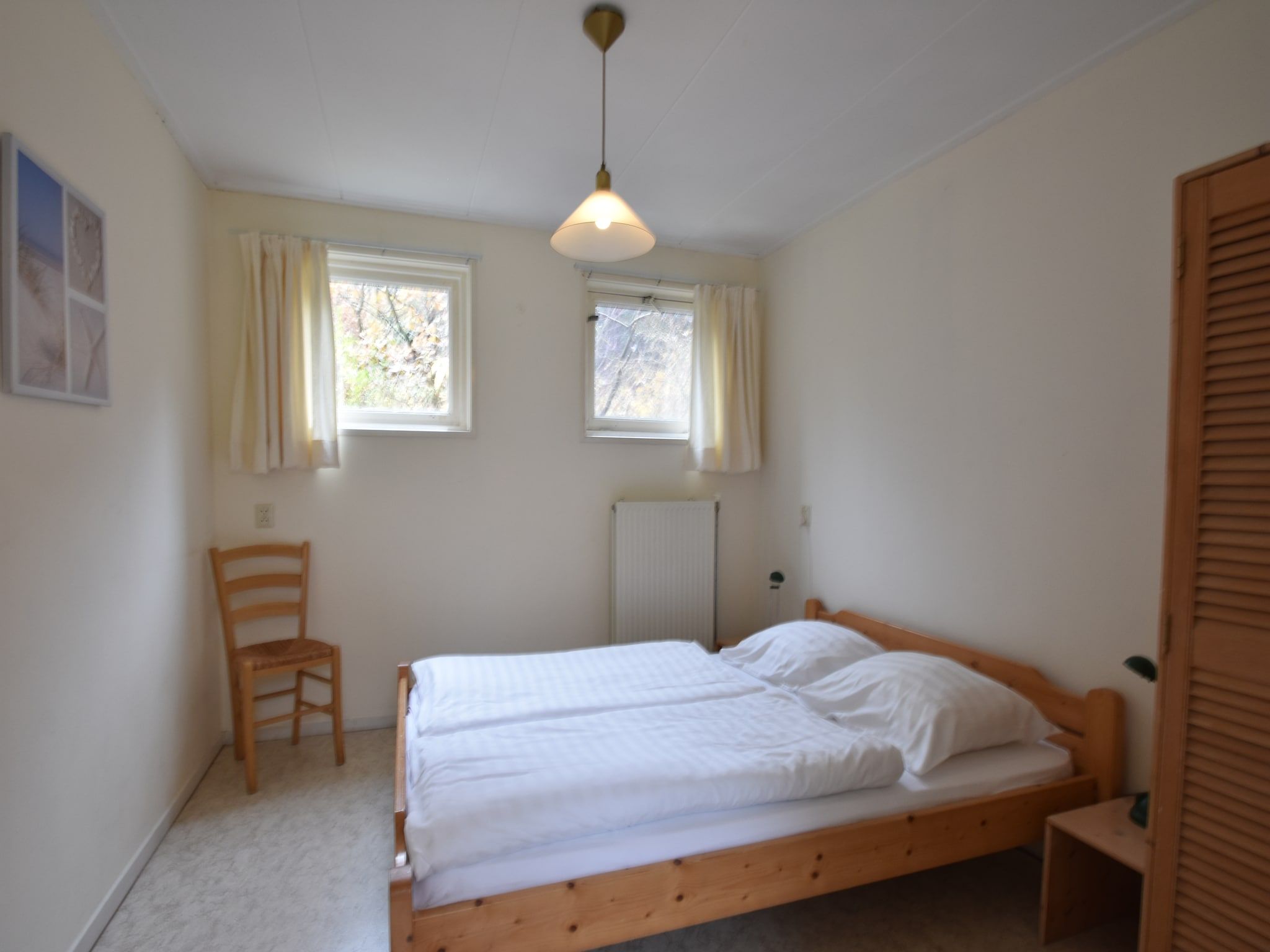 Een slaapkamer van Huize Glory Robijn in Bergen aan zee
