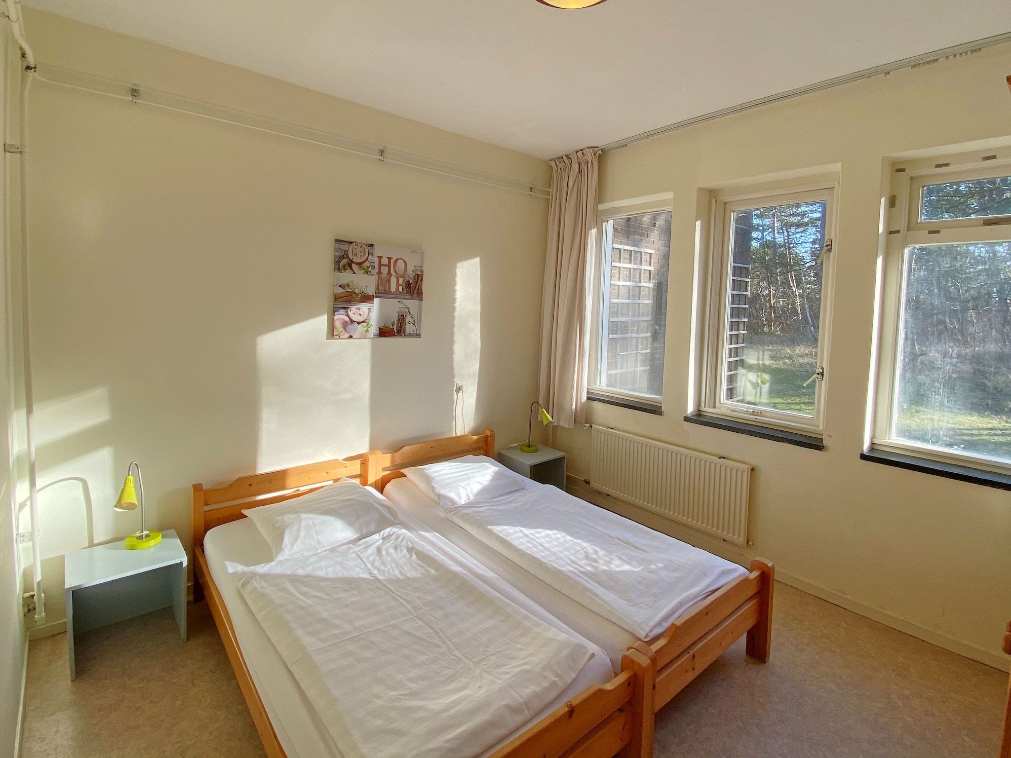 Een slaapkamer van Huize Glory Robijn in Bergen aan zee