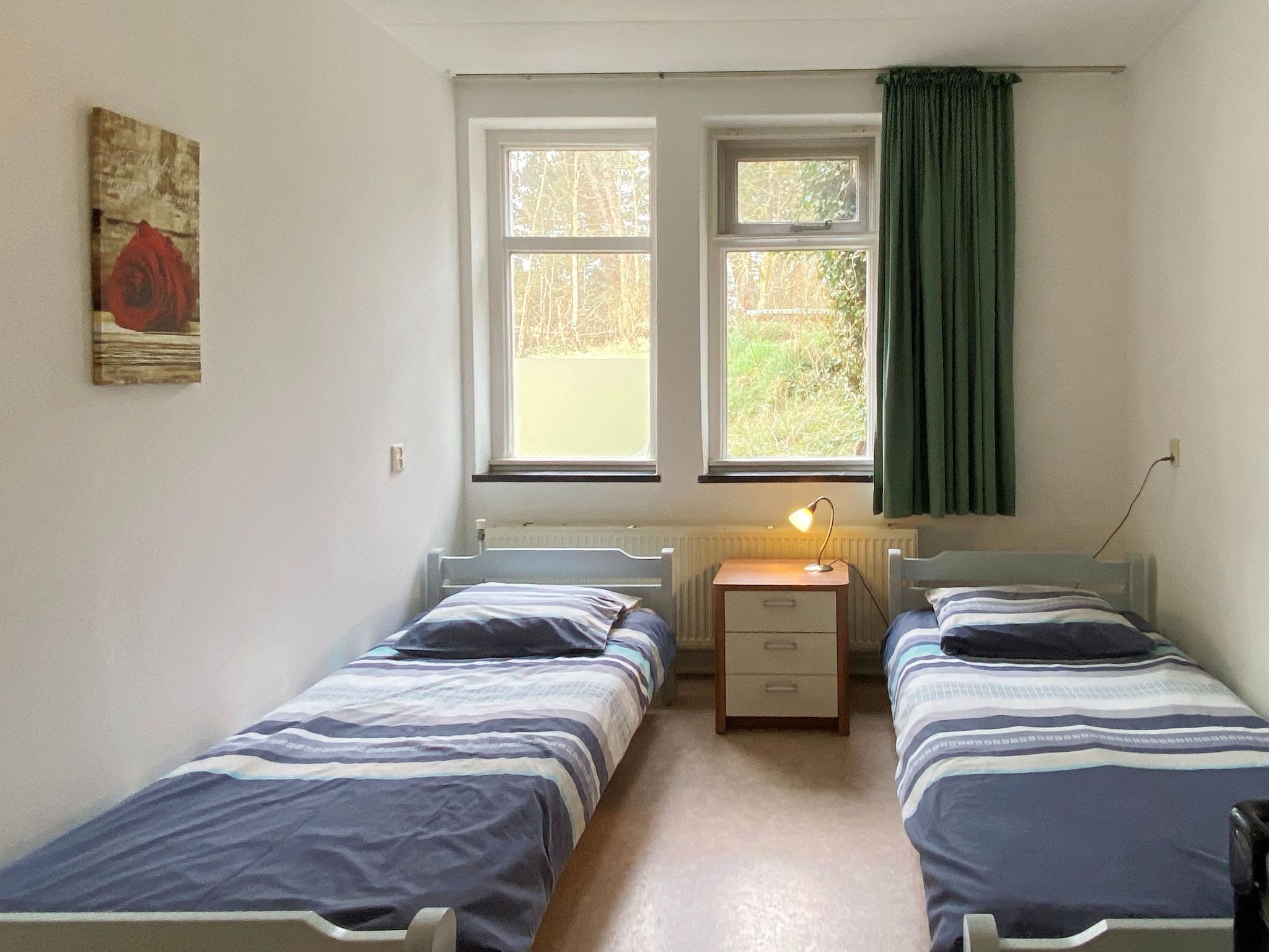 Een slaapkamer van Huize Glory Robijn in Bergen aan zee