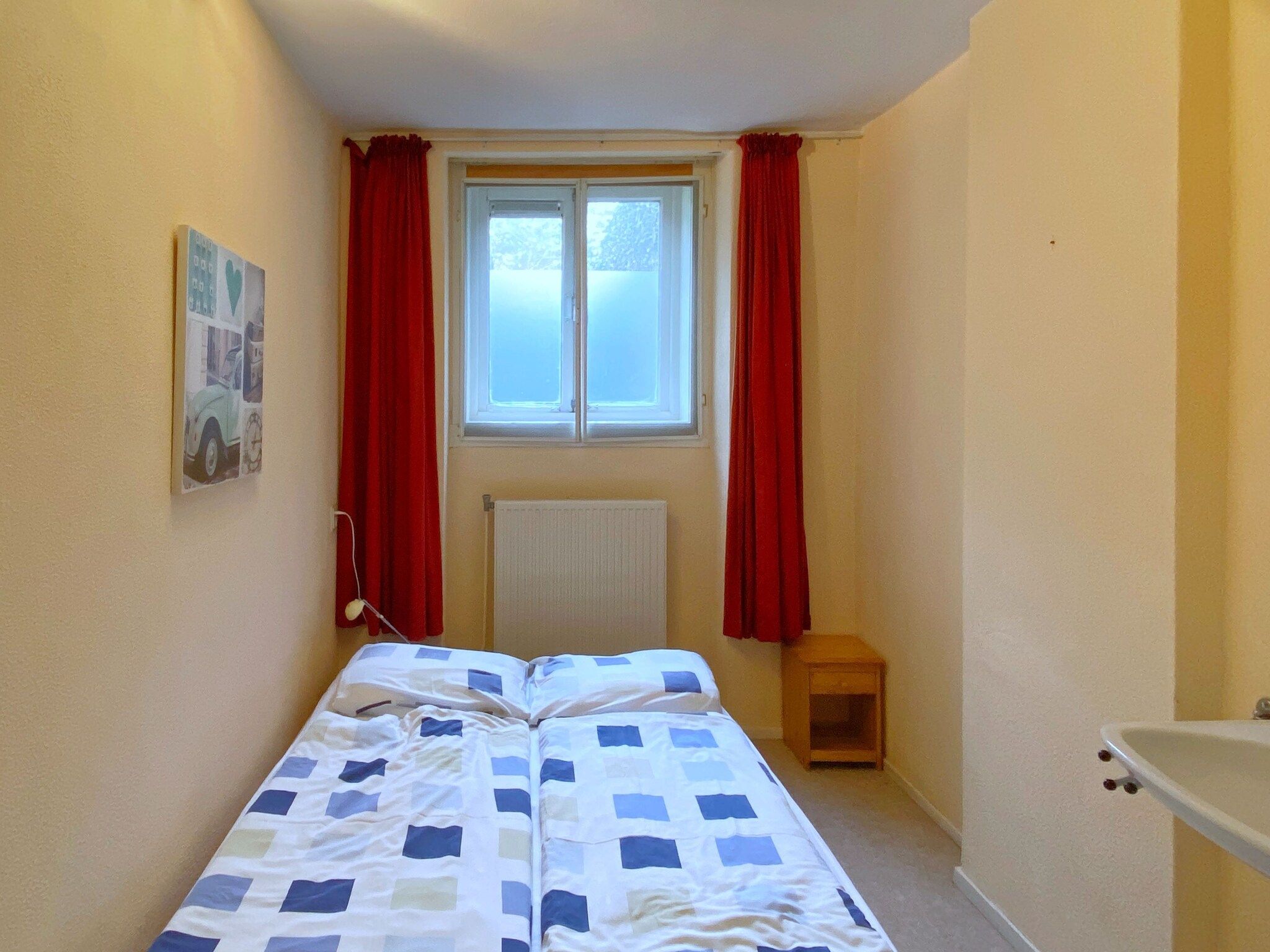 Een slaapkamer van Huize Glory Robijn in Bergen aan zee