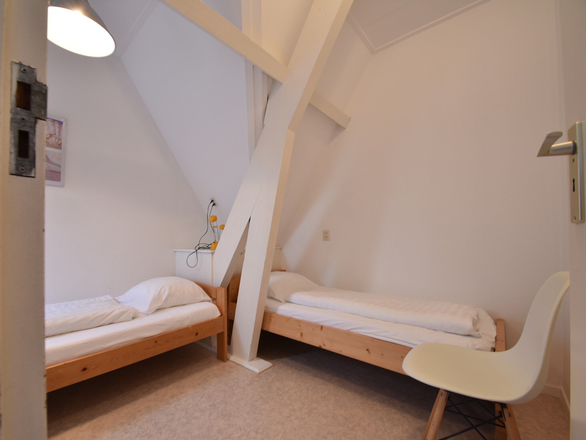 Een slaapkamer van Huize Glory Granaat in Bergen aan zee