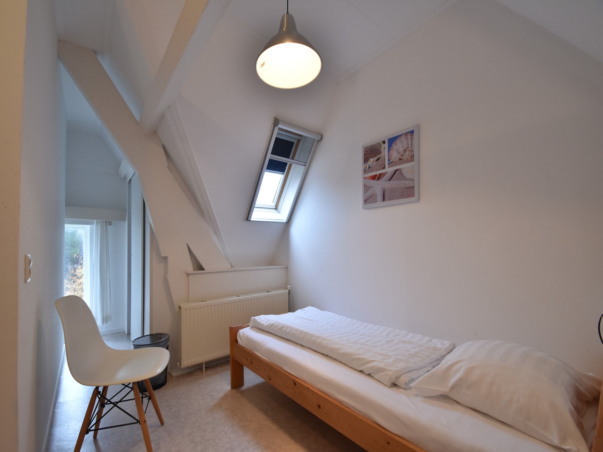 Een slaapkamer van Huize Glory Granaat in Bergen aan zee