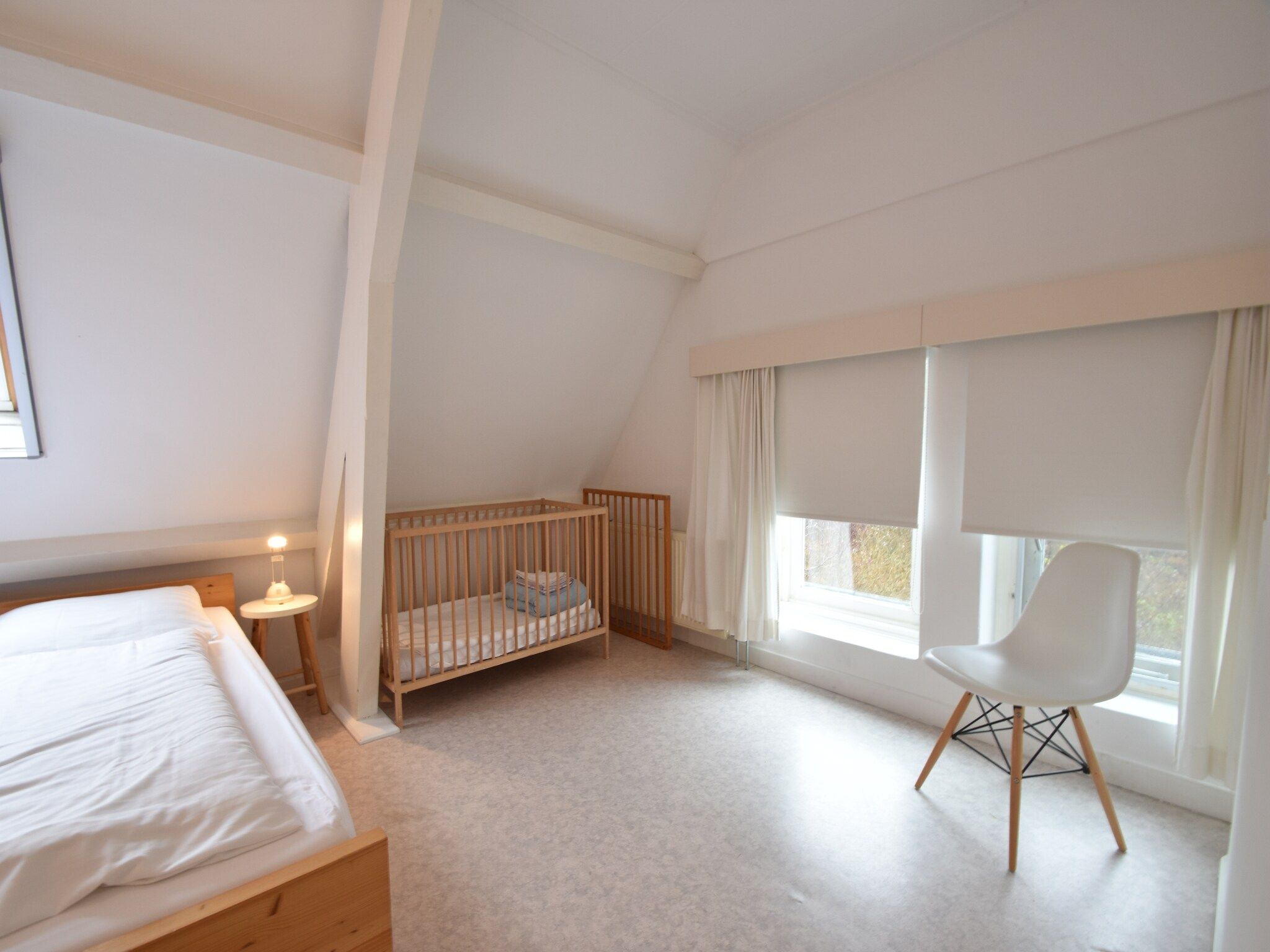 Een slaapkamer van Huize Glory Granaat in Bergen aan zee