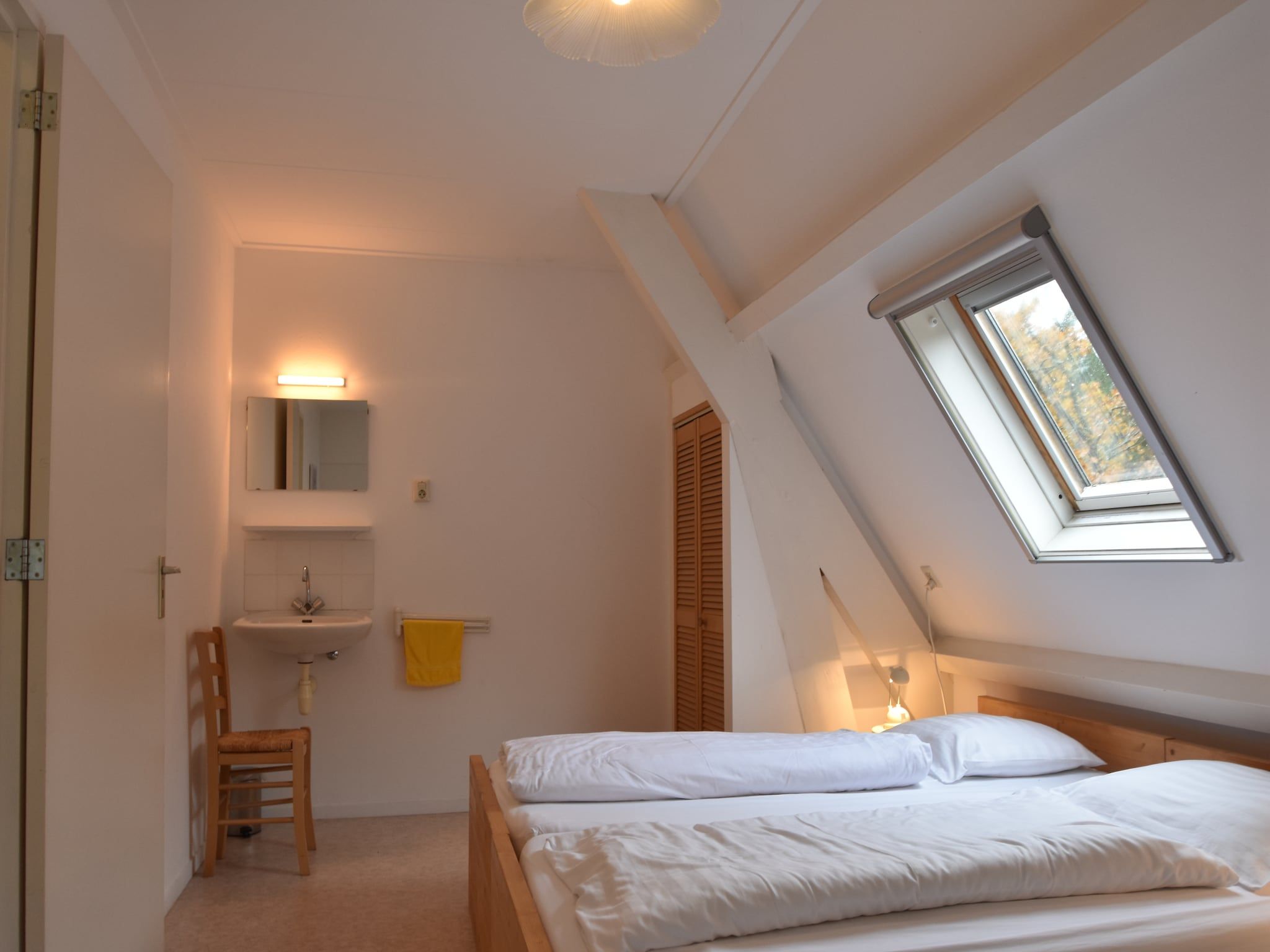 Een slaapkamer van Huize Glory Granaat in Bergen aan zee