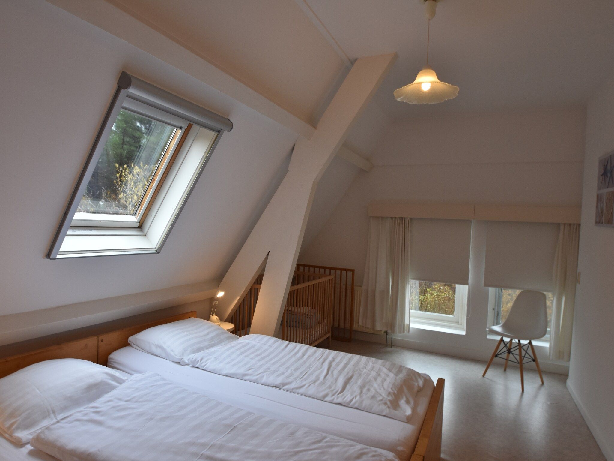 Een slaapkamer van Huize Glory Granaat in Bergen aan zee