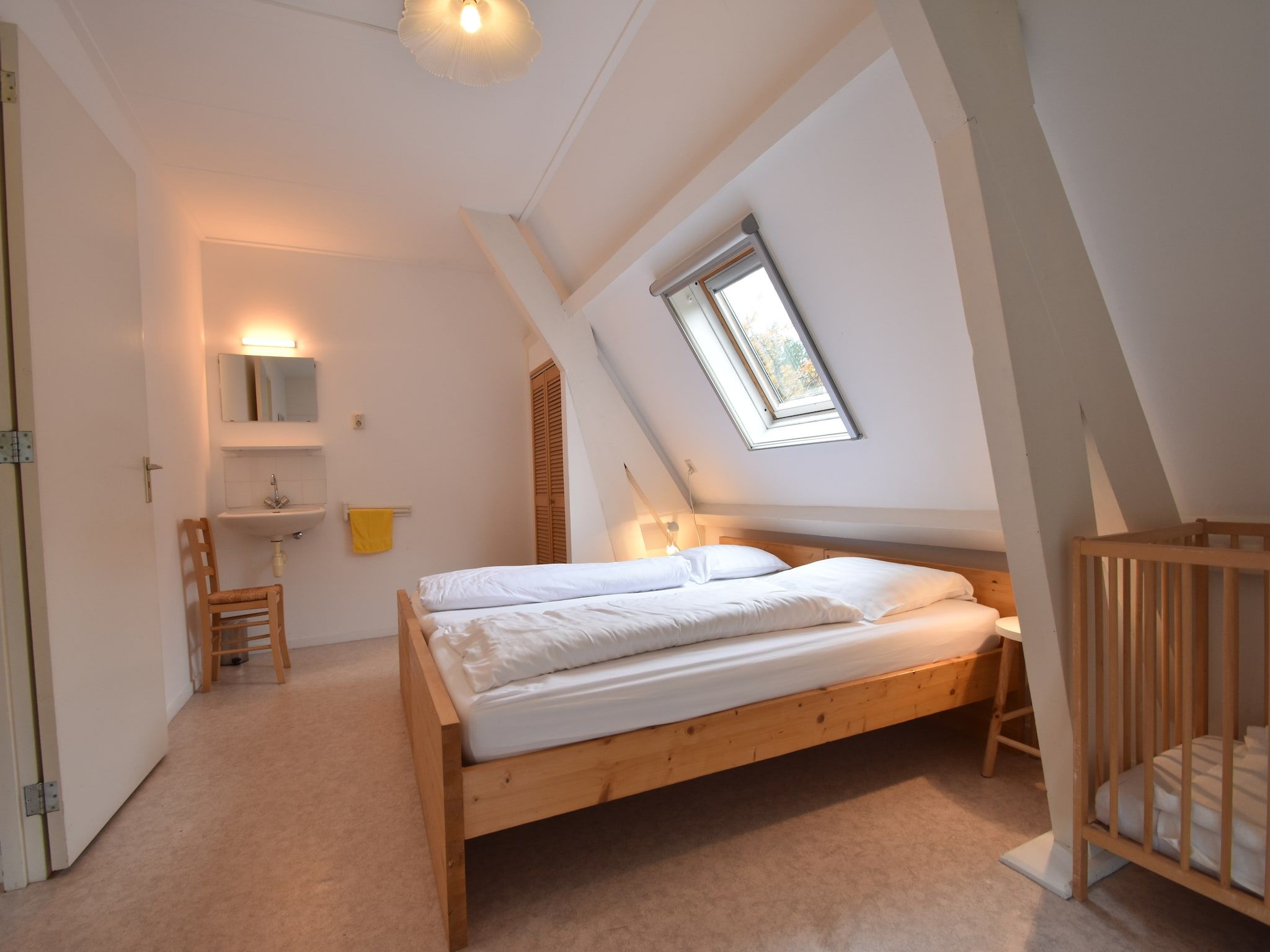 Een slaapkamer van Huize Glory Granaat in Bergen aan zee