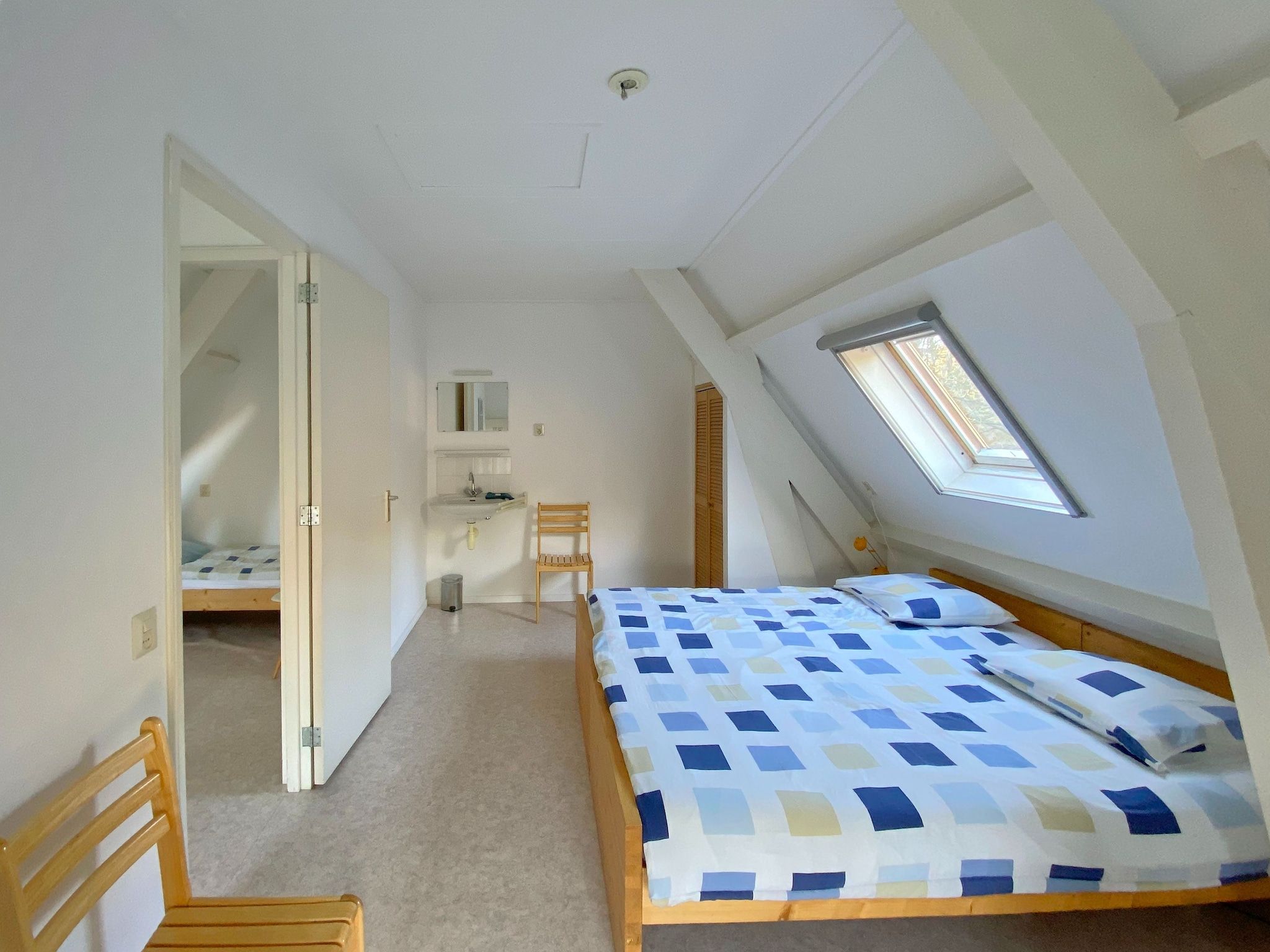 Een slaapkamer van Huize Glory Granaat in Bergen aan zee