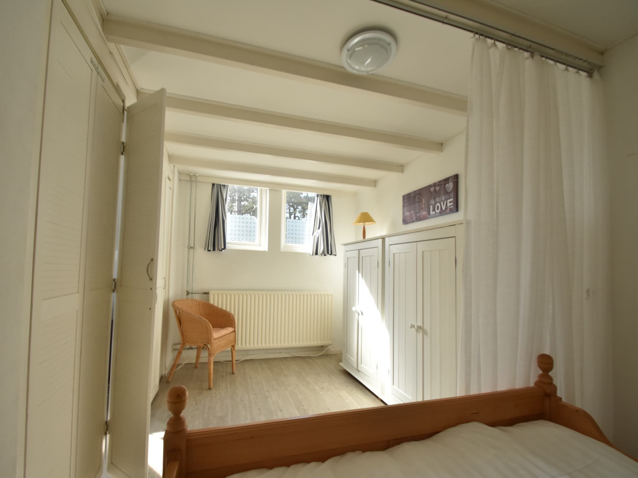 Een slaapkamer van Huize Glory Saffier in Bergen aan zee