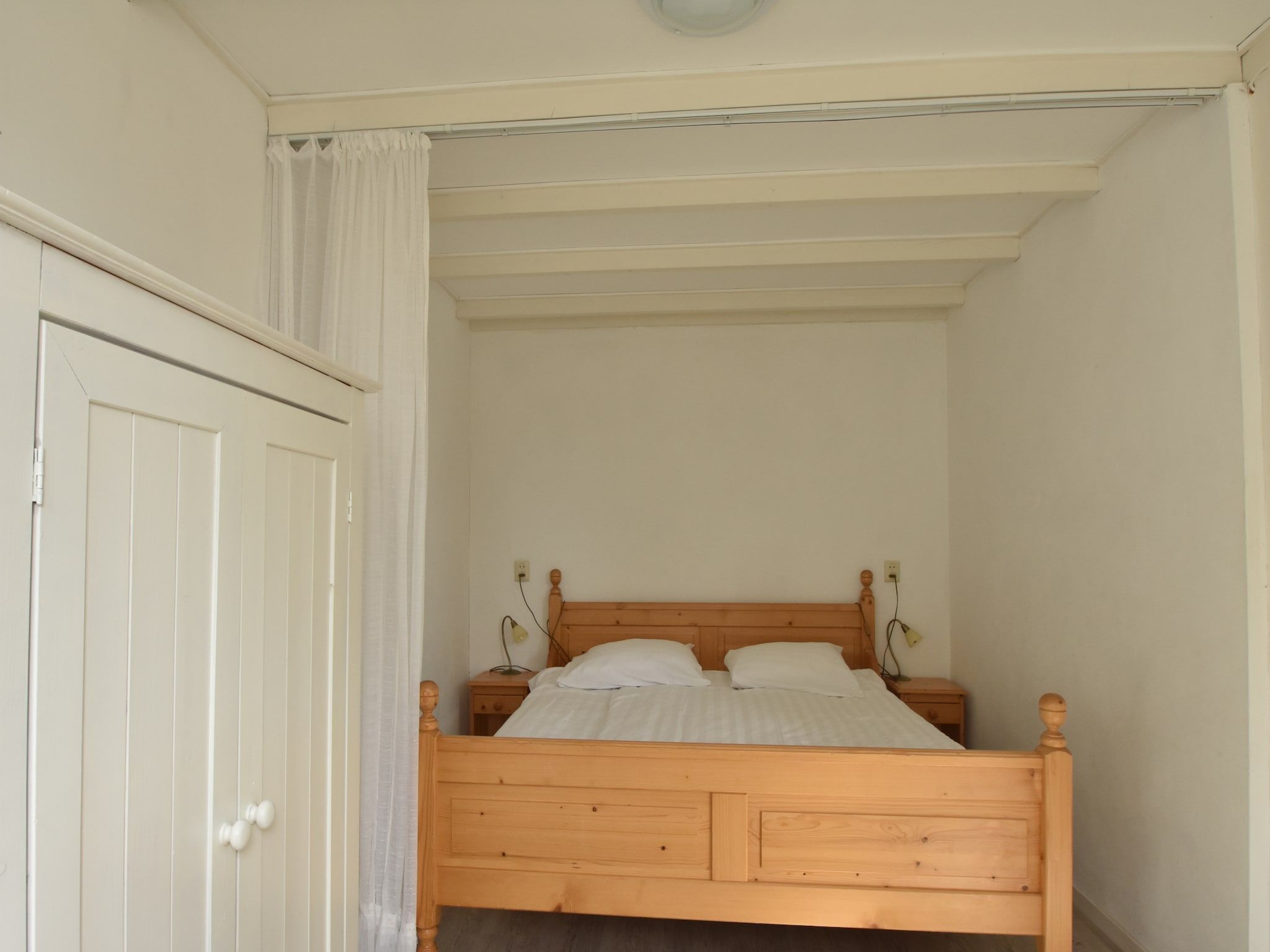 Een slaapkamer van Huize Glory Saffier in Bergen aan zee