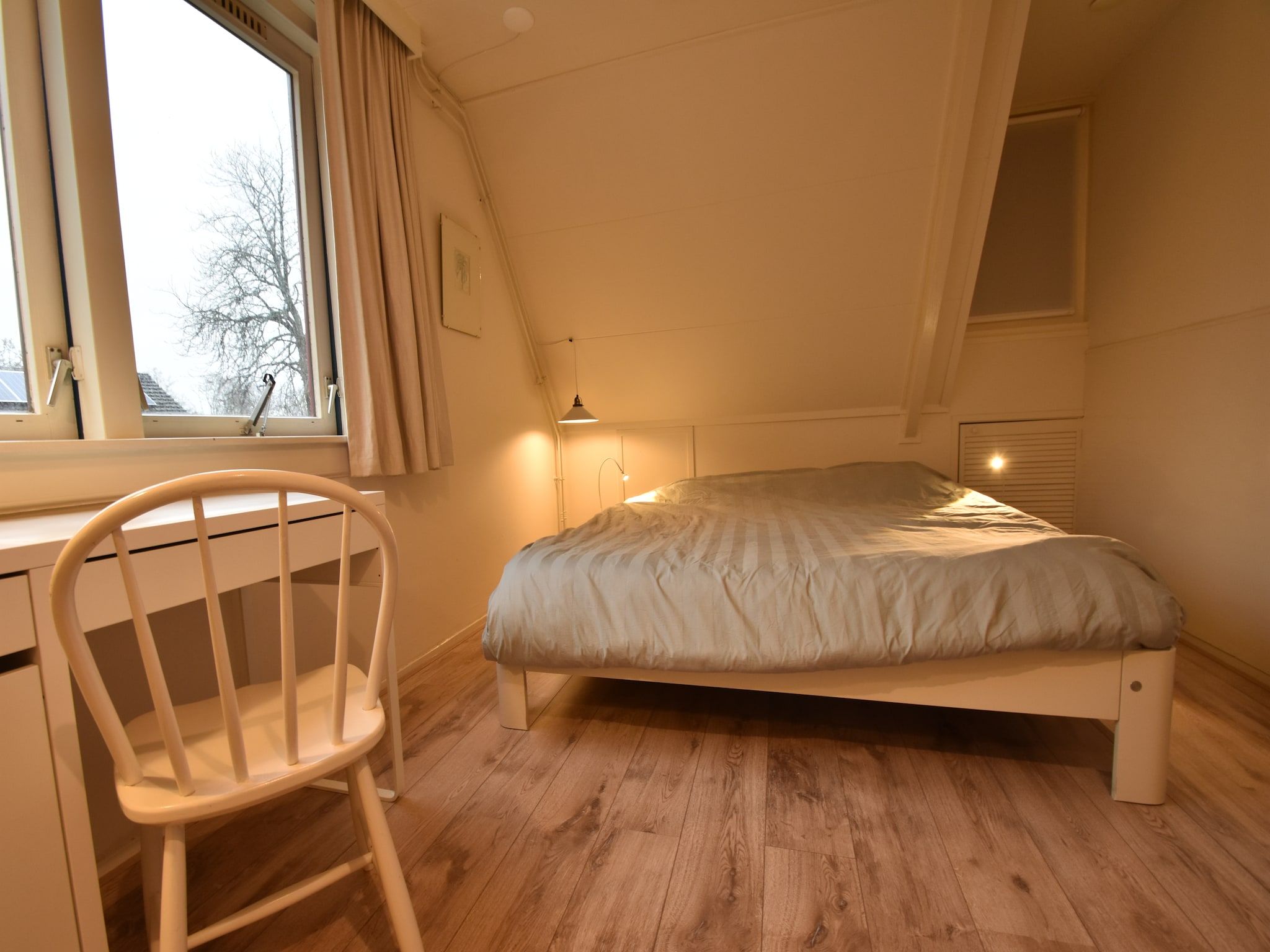 Een slaapkamer van Bergens Roodborstje in Bergen
