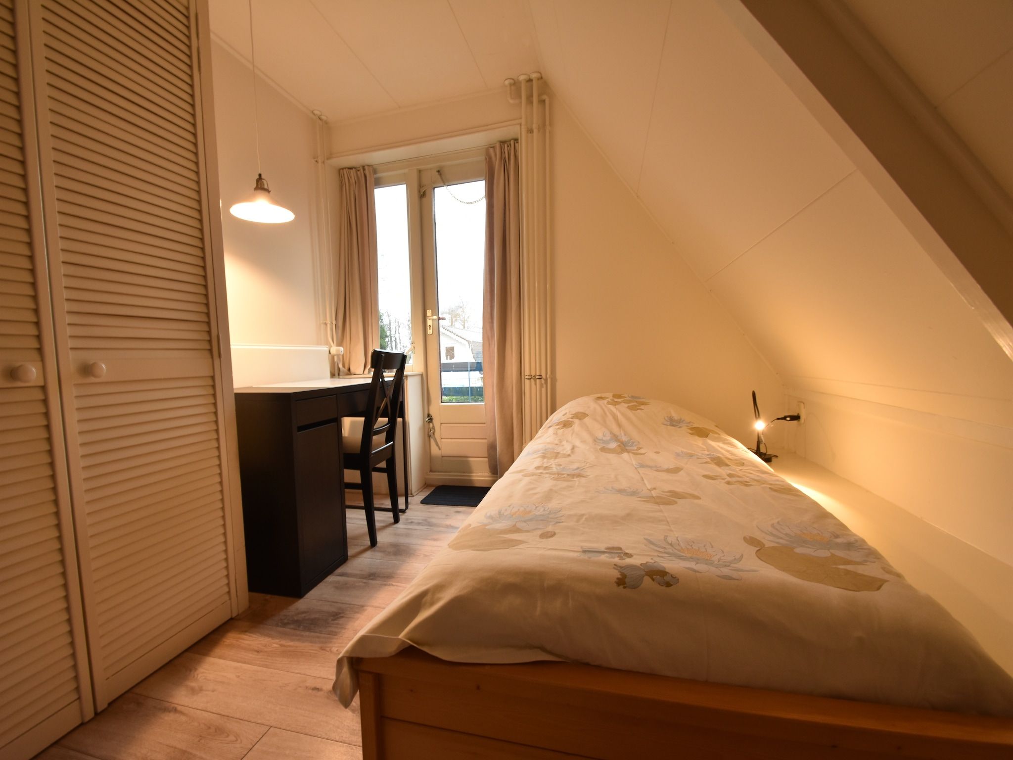 Een slaapkamer van Bergens Roodborstje in Bergen