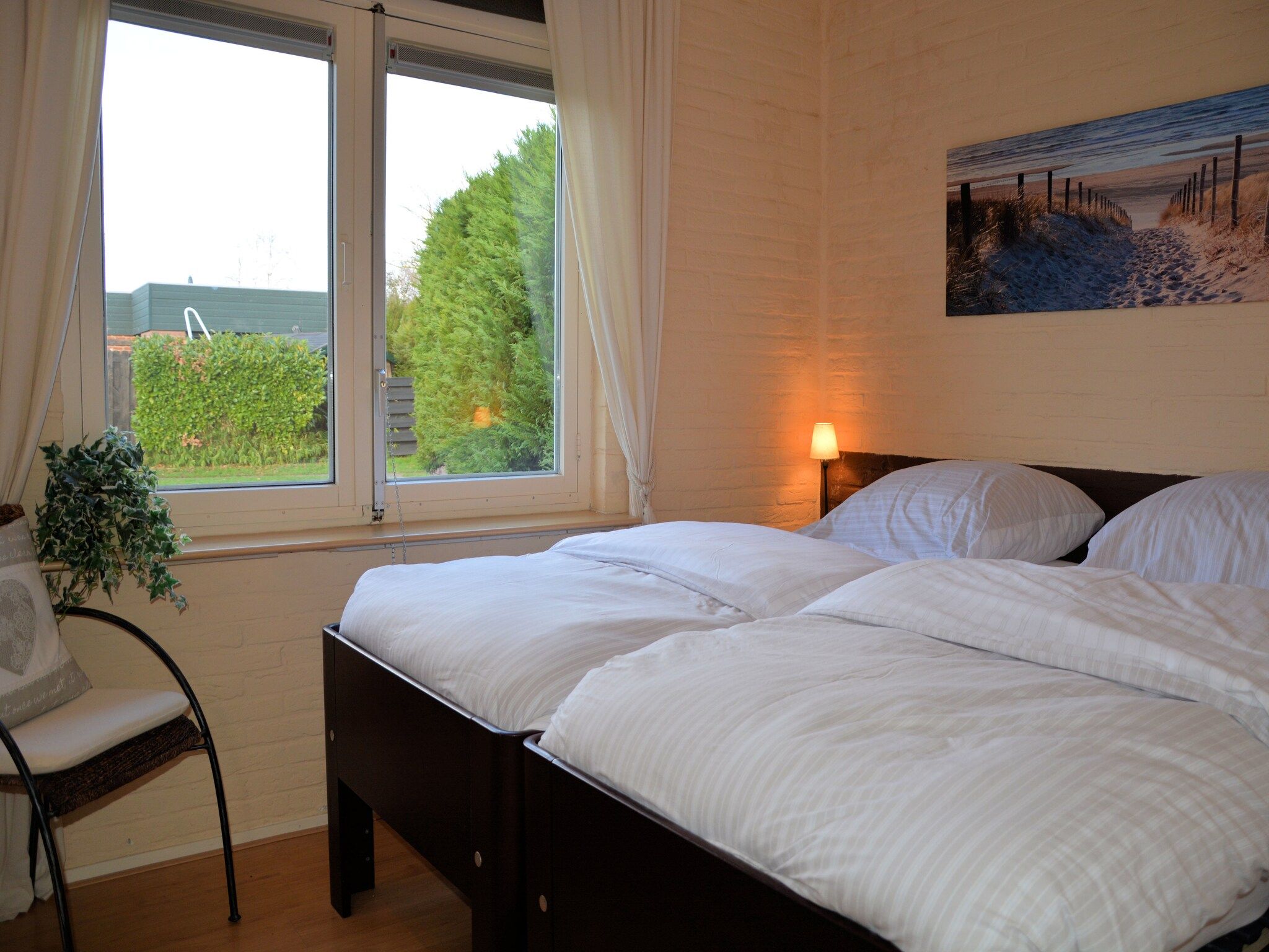Een slaapkamer van Bos-Lodge in Noordwijkerhout