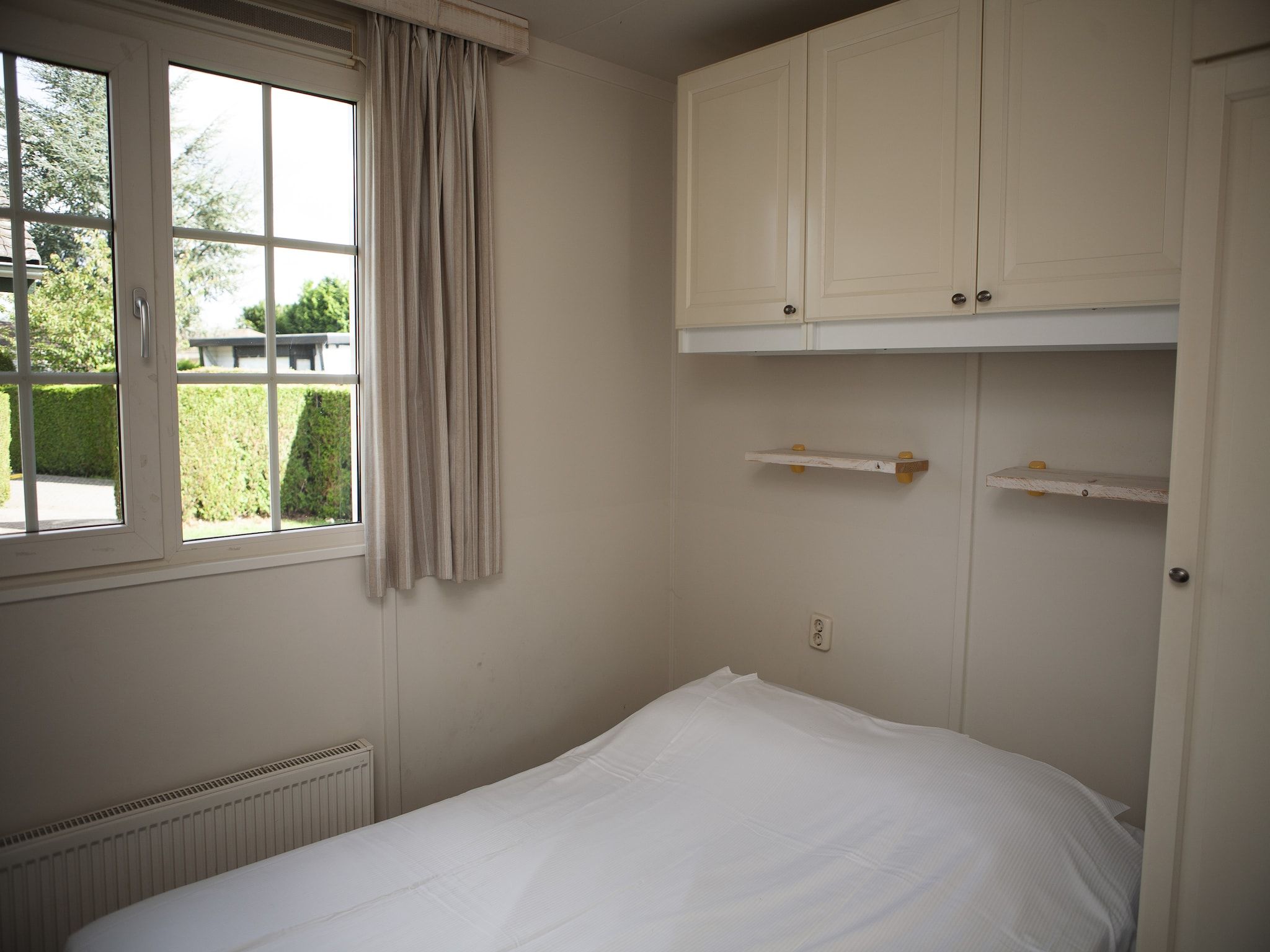 Een slaapkamer van Recreatiepark de Boshoek 11 in Voorthuizen