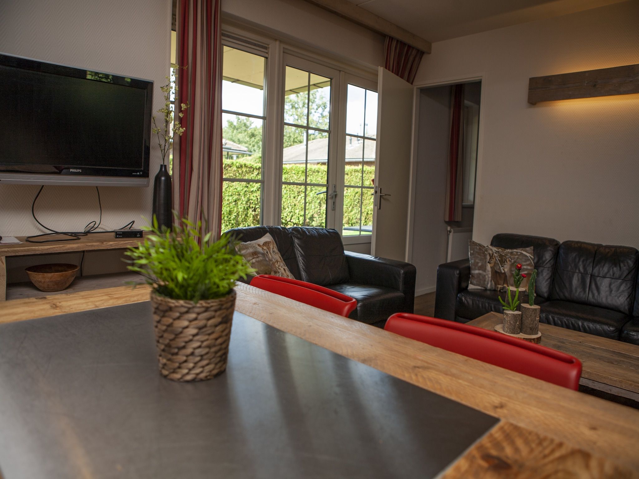 De woonkamer van Recreatiepark de Boshoek 12 in Voorthuizen