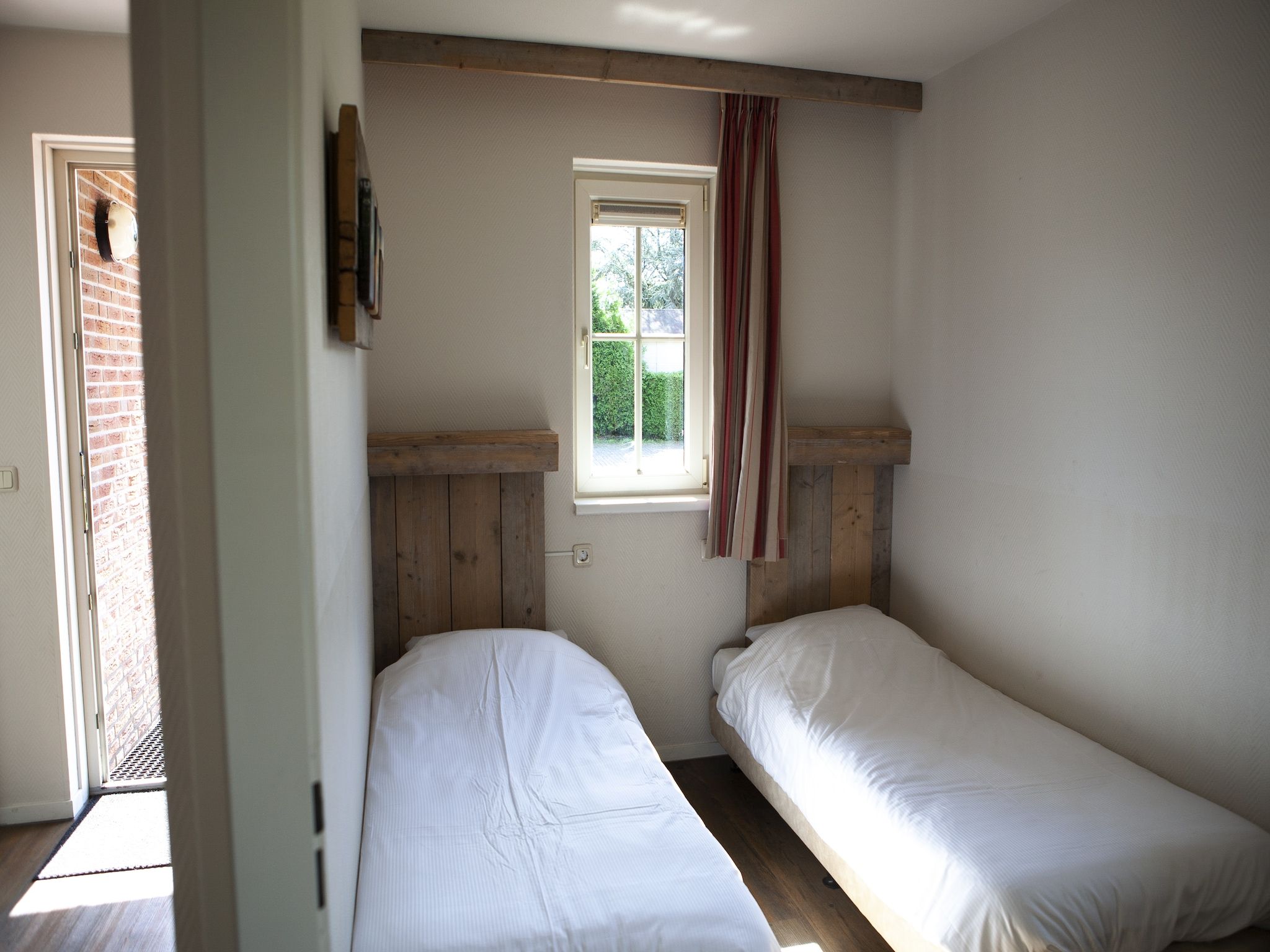 Een slaapkamer van Recreatiepark de Boshoek 15 in Voorthuizen