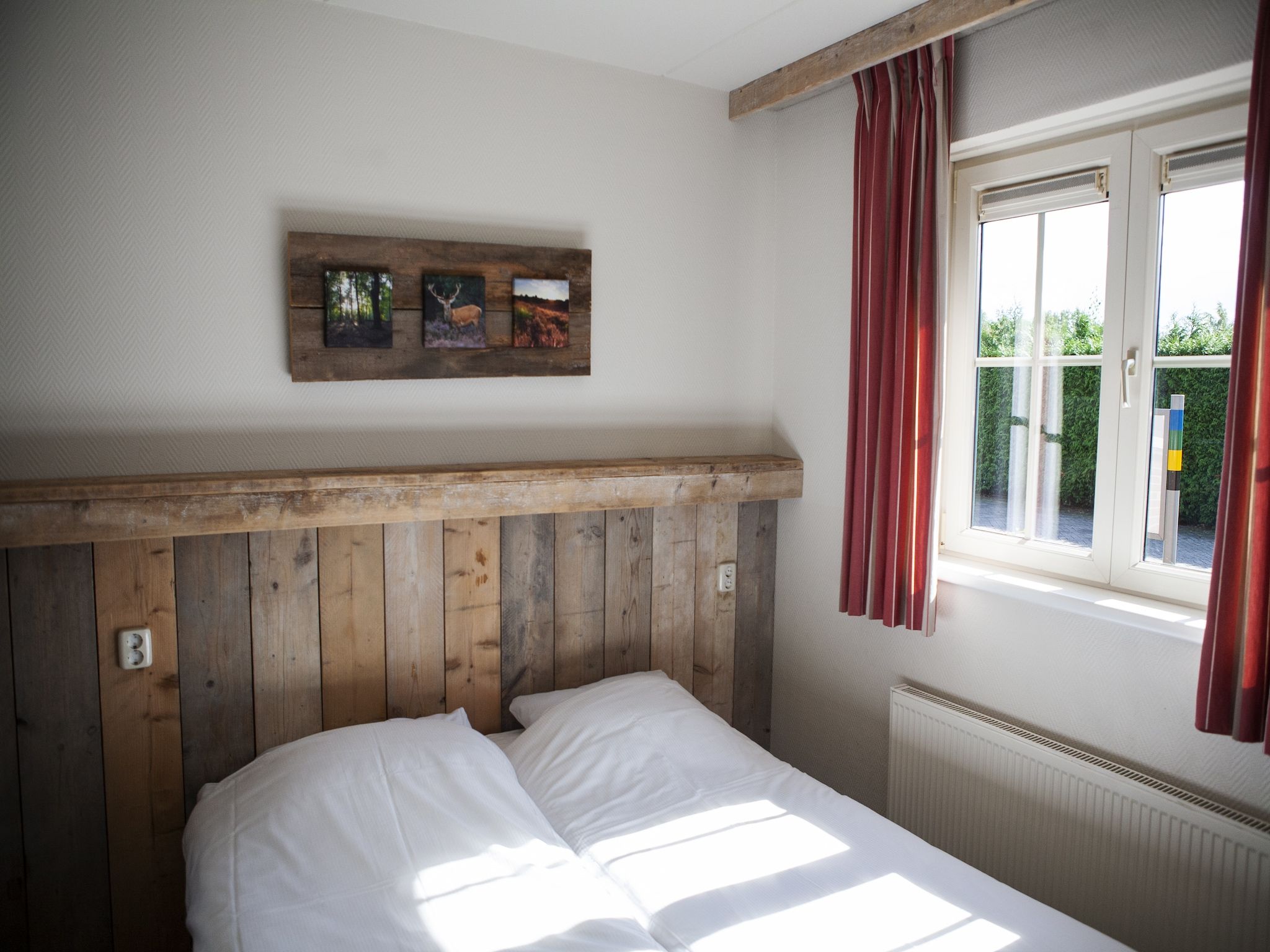 Een slaapkamer van Recreatiepark de Boshoek 15 in Voorthuizen
