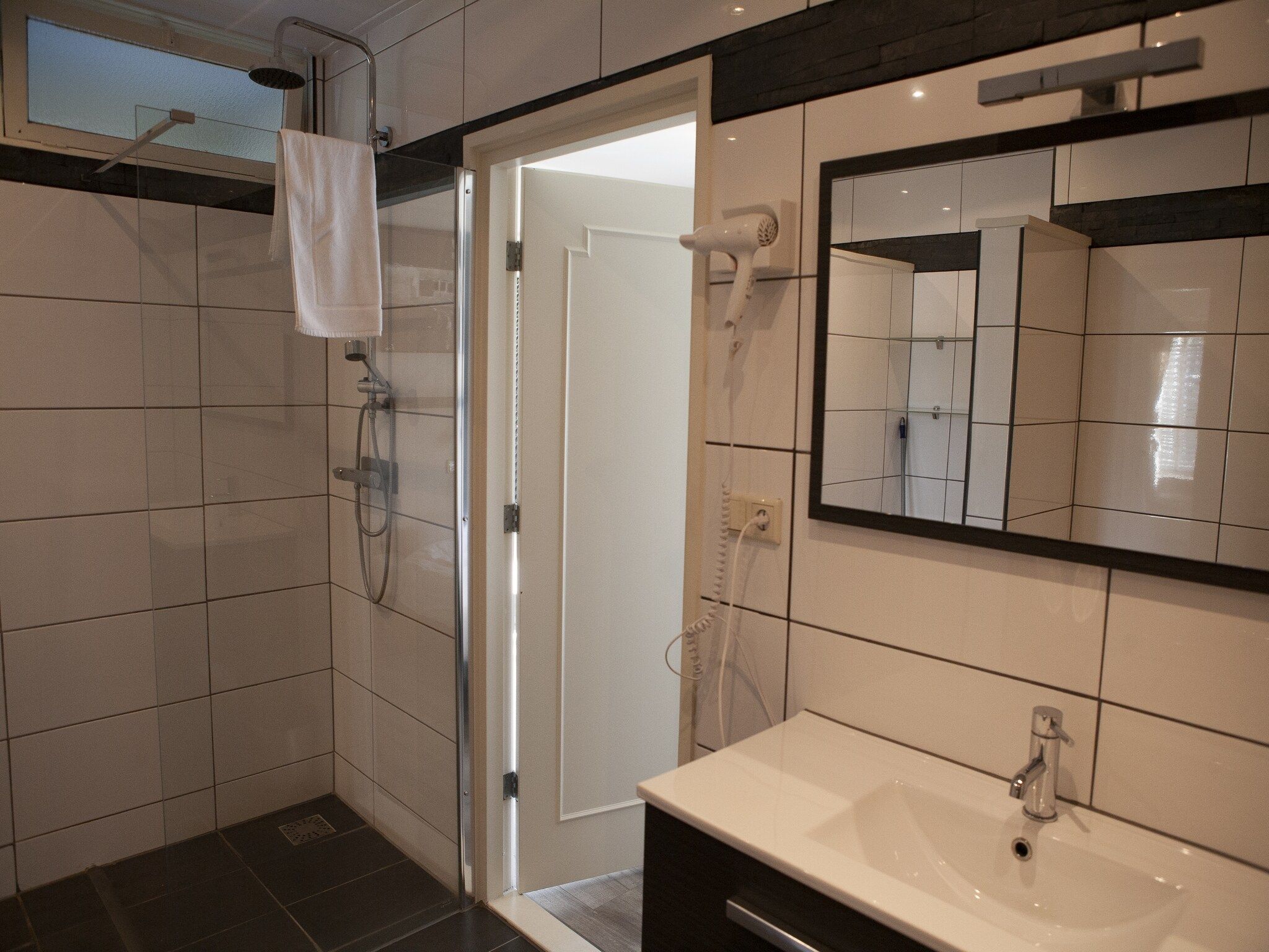 De badkamer van Recreatiepark de Boshoek 18 in Voorthuizen