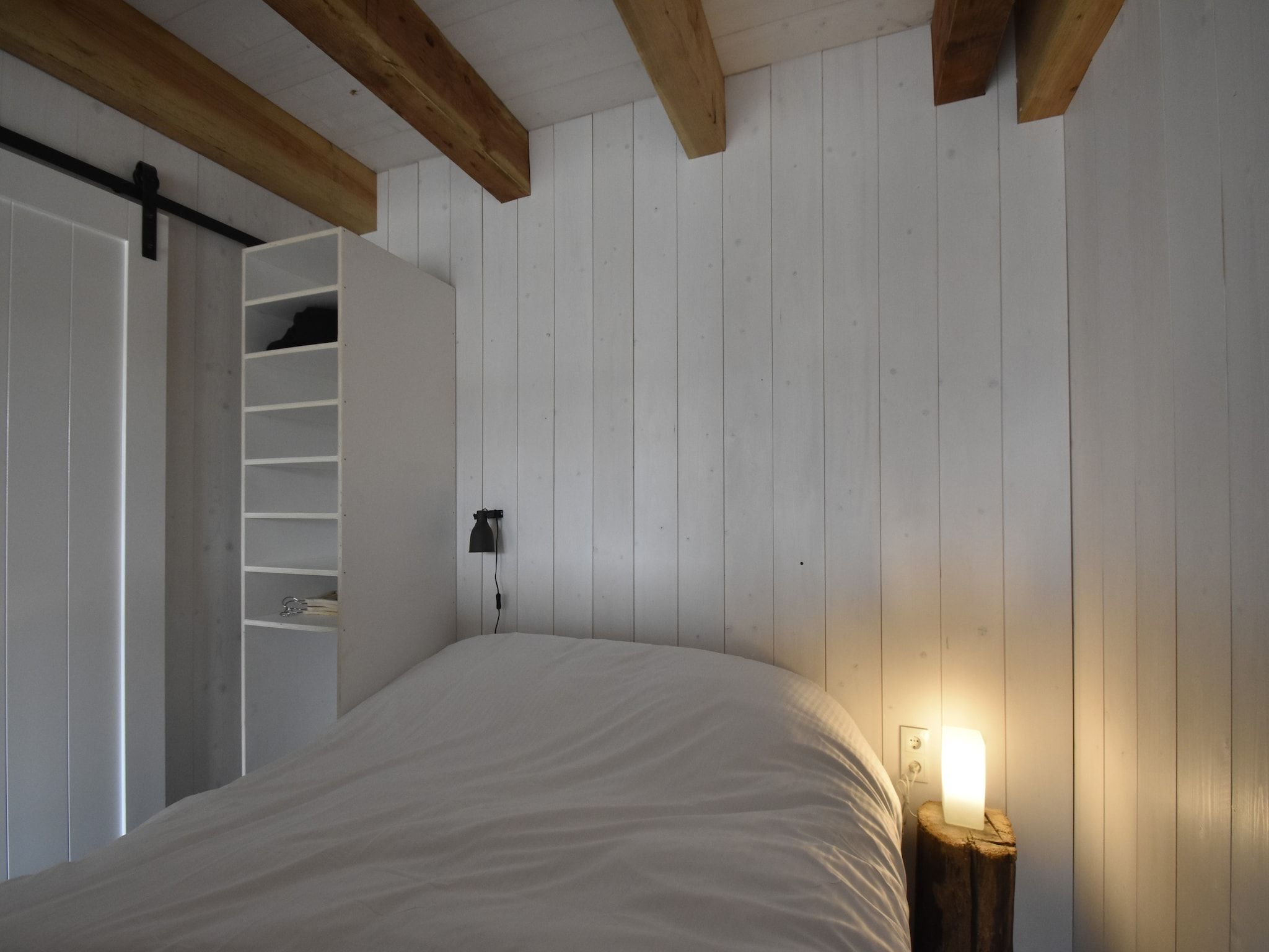 Een slaapkamer van Hazenborgh - Studio Vloed in Callantsoog