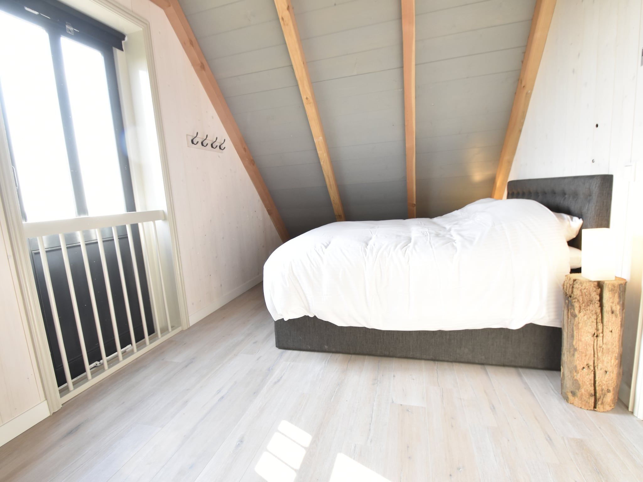 Een slaapkamer van Hazenborgh - Strandhuys in Callantsoog