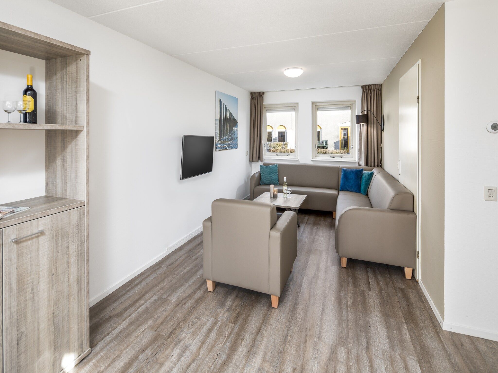 De woonkamer van Vakantiepark Soeten Haert 13 in Renesse