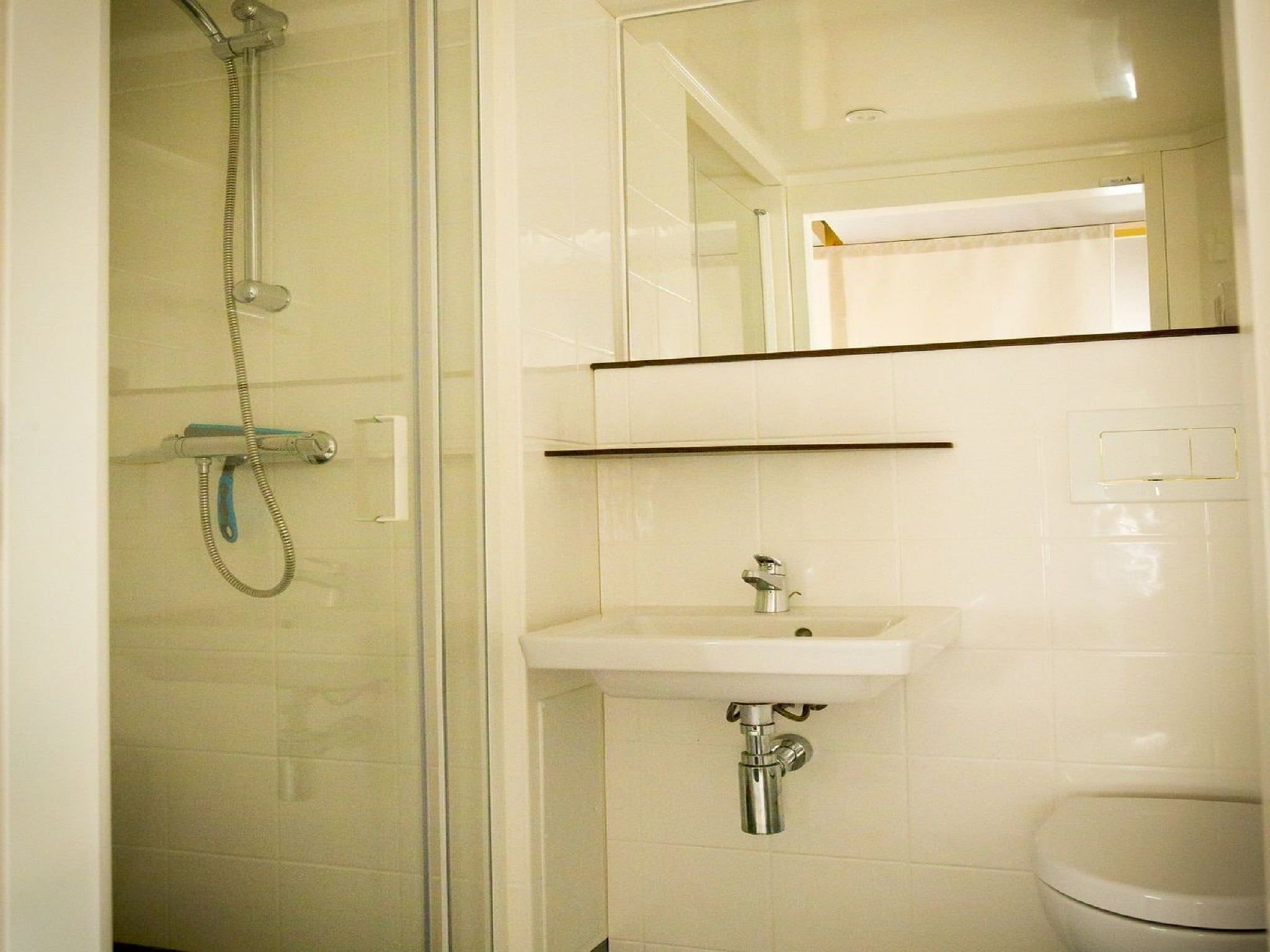 De badkamer van Recreatiepark Duinhoeve 7 in Udenhout