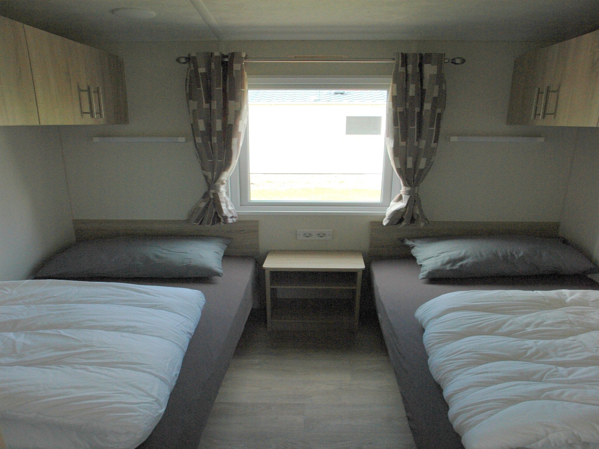 Een slaapkamer van Recreatiepark Duinhoeve 9 in Udenhout